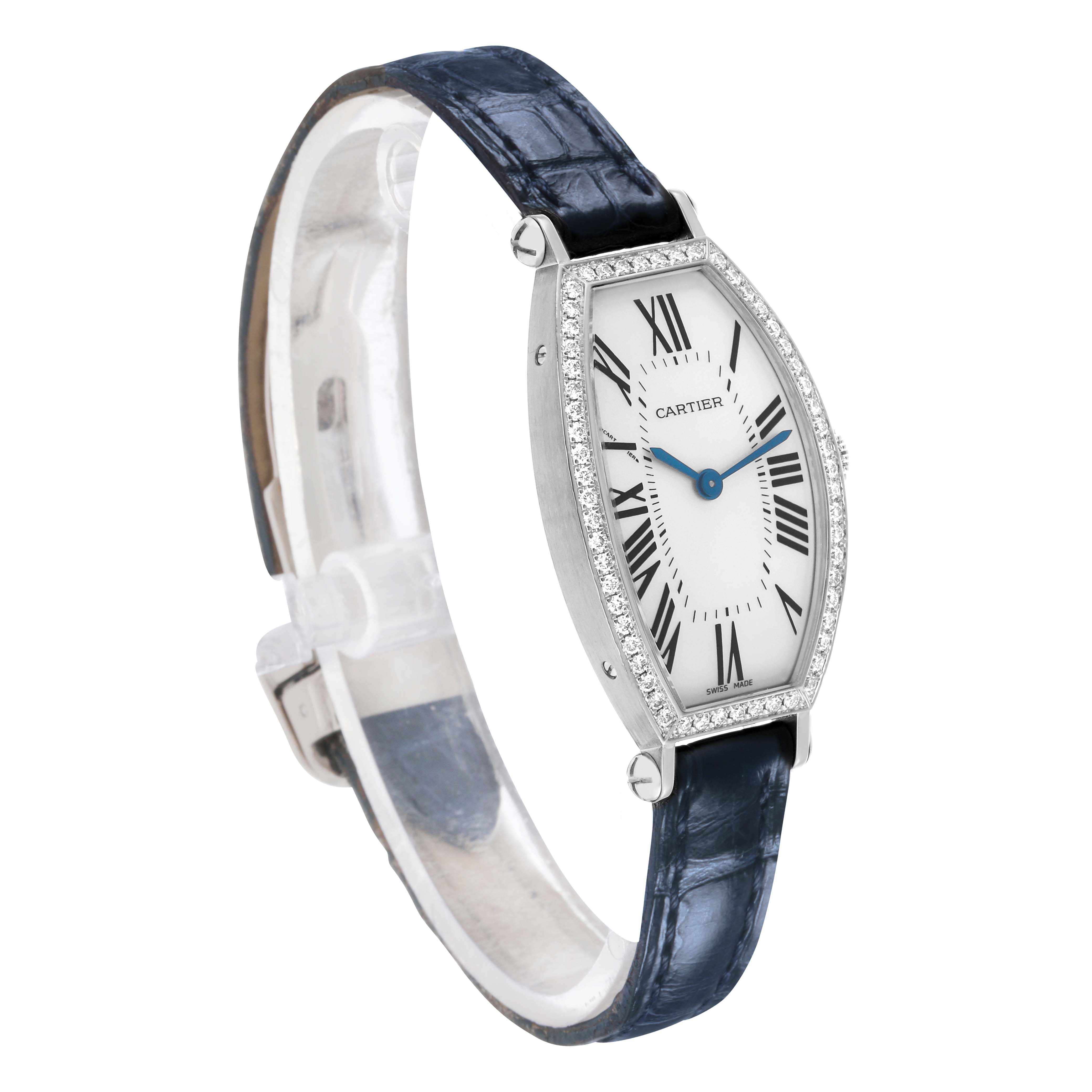 The Cartier Tonneau WE400131 Women's White Gold Silver Dial watch is shown at a slight angle, highlighting its case, bezel, face, and blue leather strap.