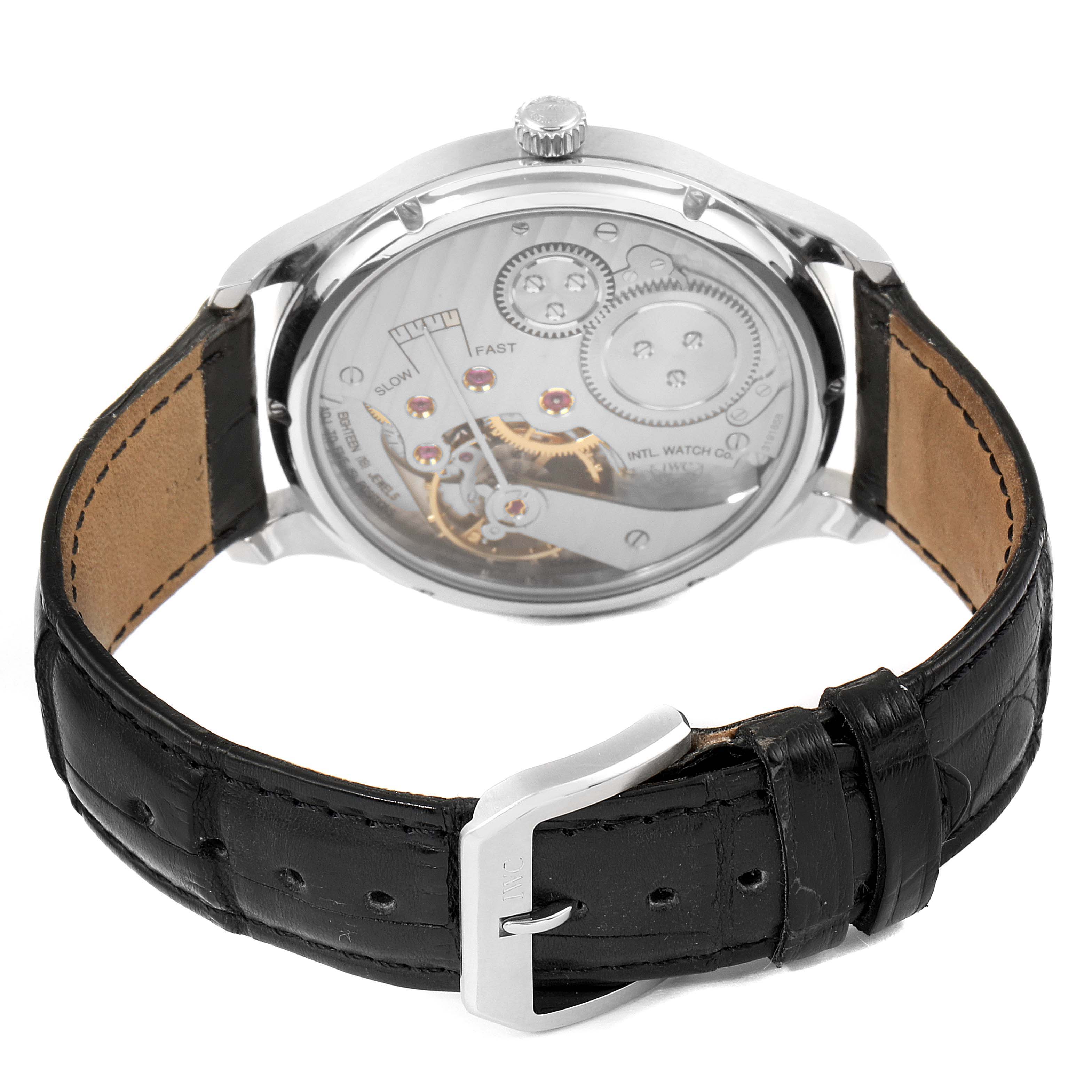 The image shows the back of the IWC Portuguese IW545405 Men's Stainless Steel Silver Dial IW545405 Men's Stainless Steel Silver Dial model watch, featuring the leather strap and the watch’s exposed movement.