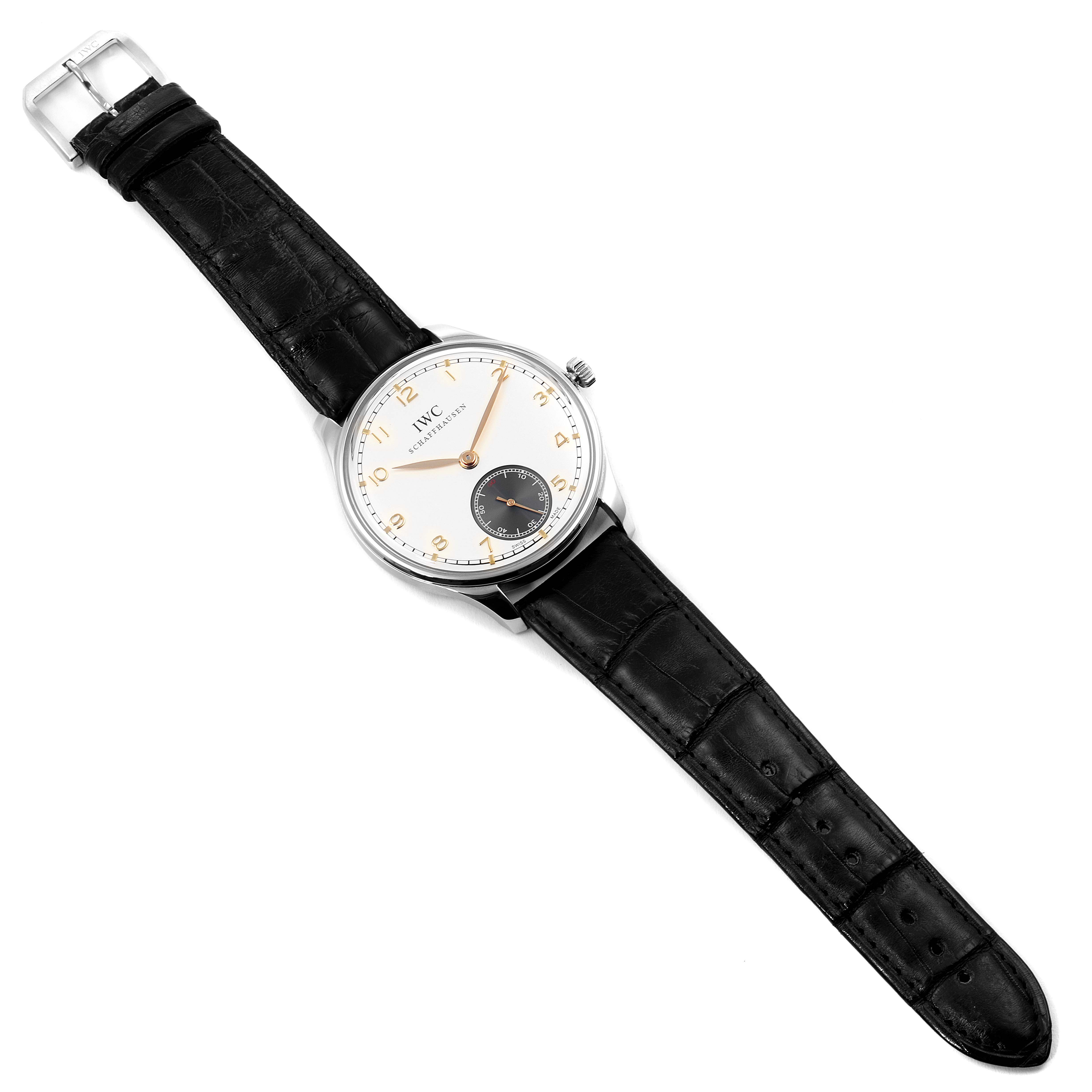 The image shows a Portuguese model by IWC from a top-down angle, highlighting its face, hands, crown, and leather strap.