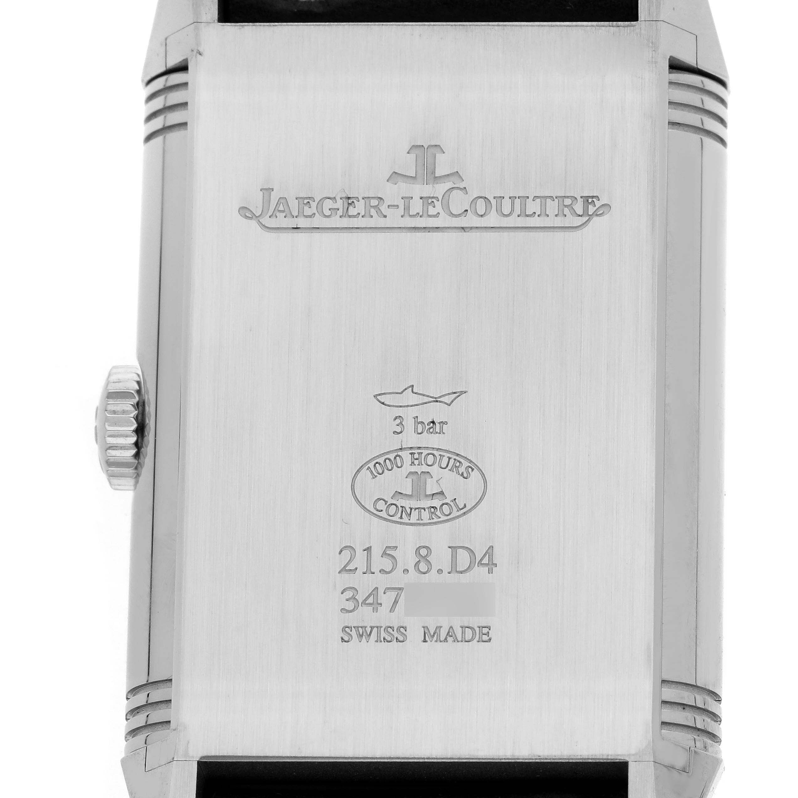 The image shows the back of the Jaeger-LeCoultre Reverso, featuring brand engravings and specifications.