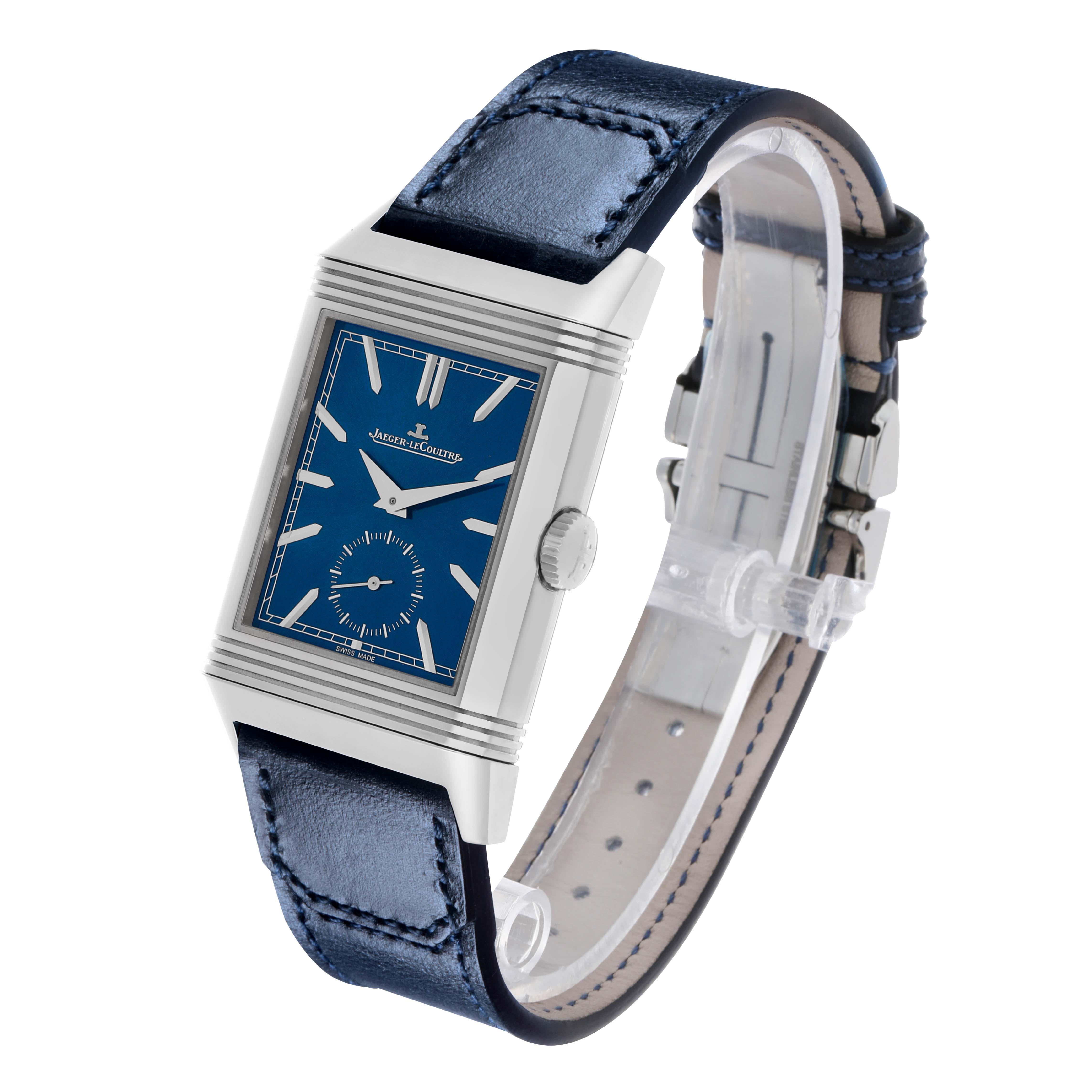 The image shows a Jaeger LeCoultre Reverso Q3988482/215.8.D4 Men's Stainless Steel Blue Dial watch at a three-quarter angle, displaying the blue dial, crown, and leather strap.