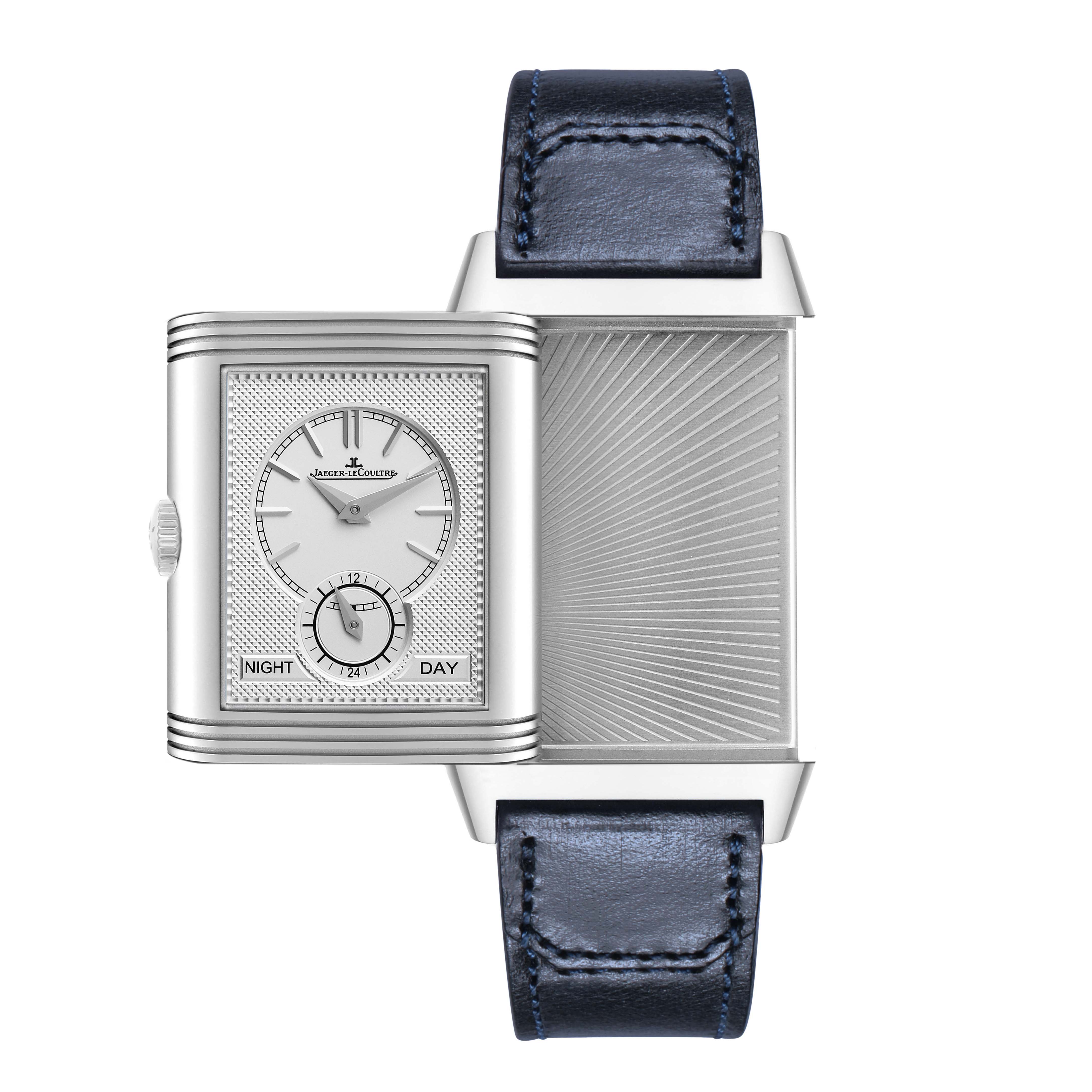 The Jaeger-LeCoultre Reverso watch is shown with its reversible case open, displaying the dial and the sunburst pattern on the back.