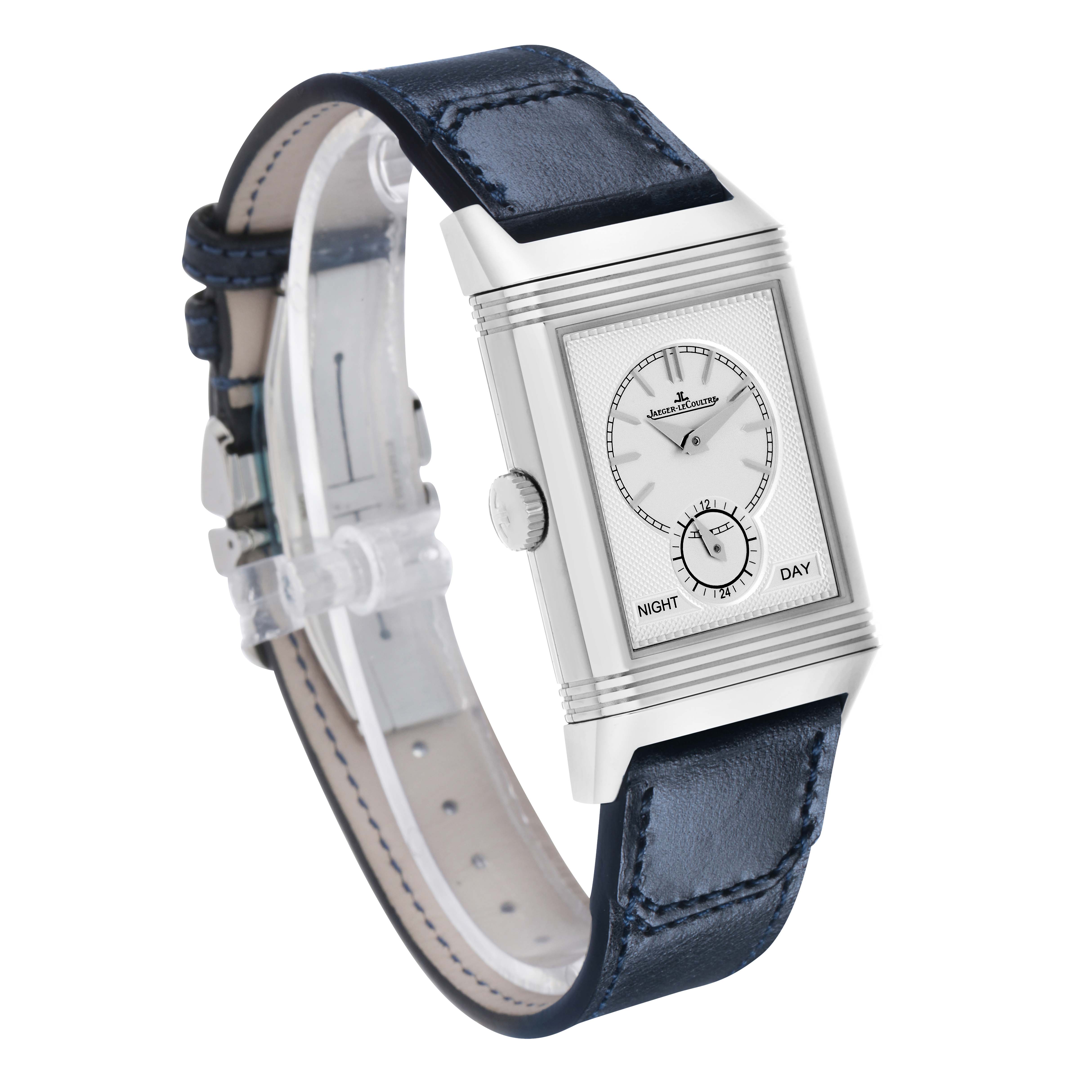 The Jaeger-LeCoultre Reverso watch is shown at a three-quarter angle, displaying the face, case, crown, and leather strap.