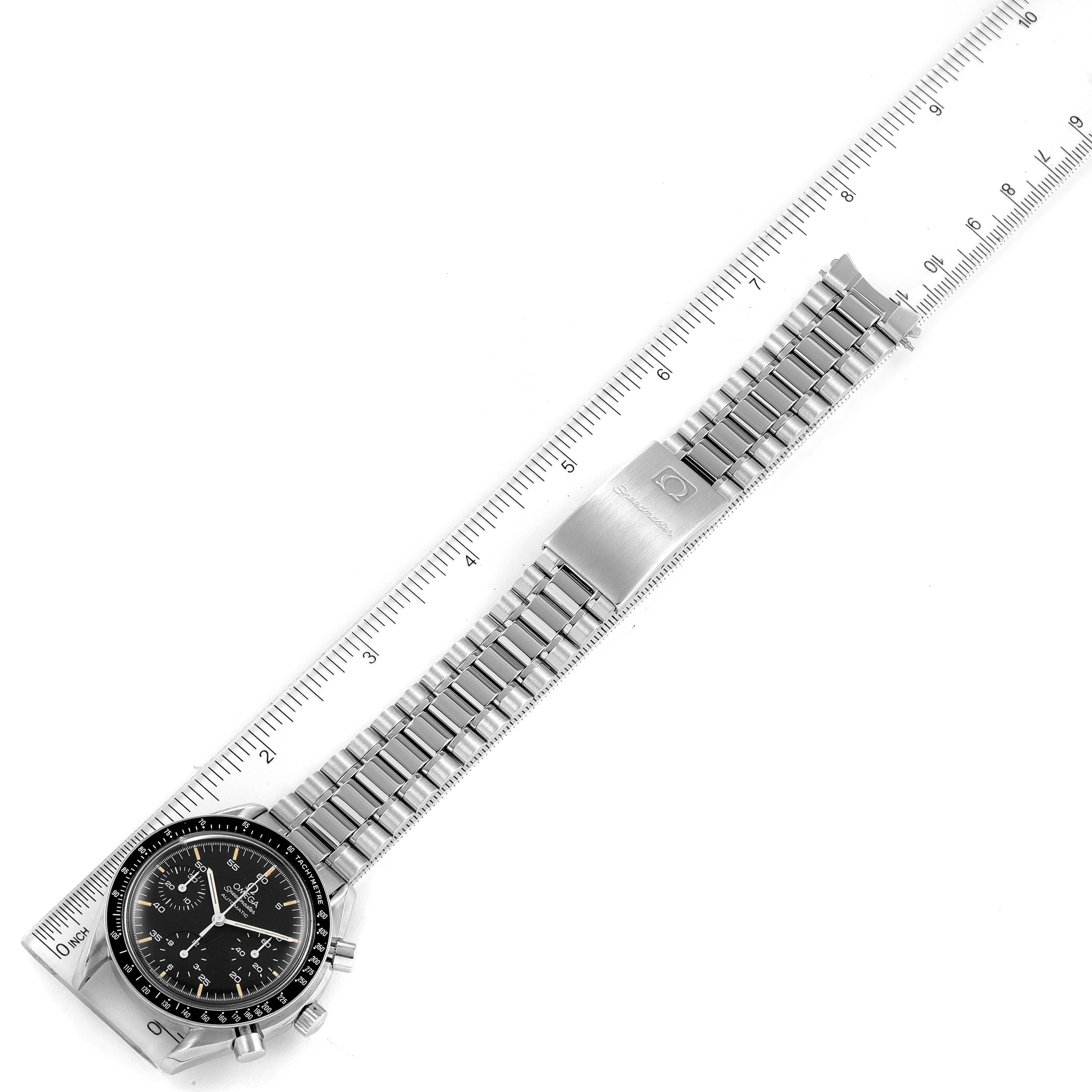 The Omega Speedmaster 3510.50.00 Men
s Stainless Steel Black Dial 3510.50.00 Men
s Stainless Steel Black Dial watch is shown flat with its full face, bracelet, and clasp, alongside a ruler for measurement.