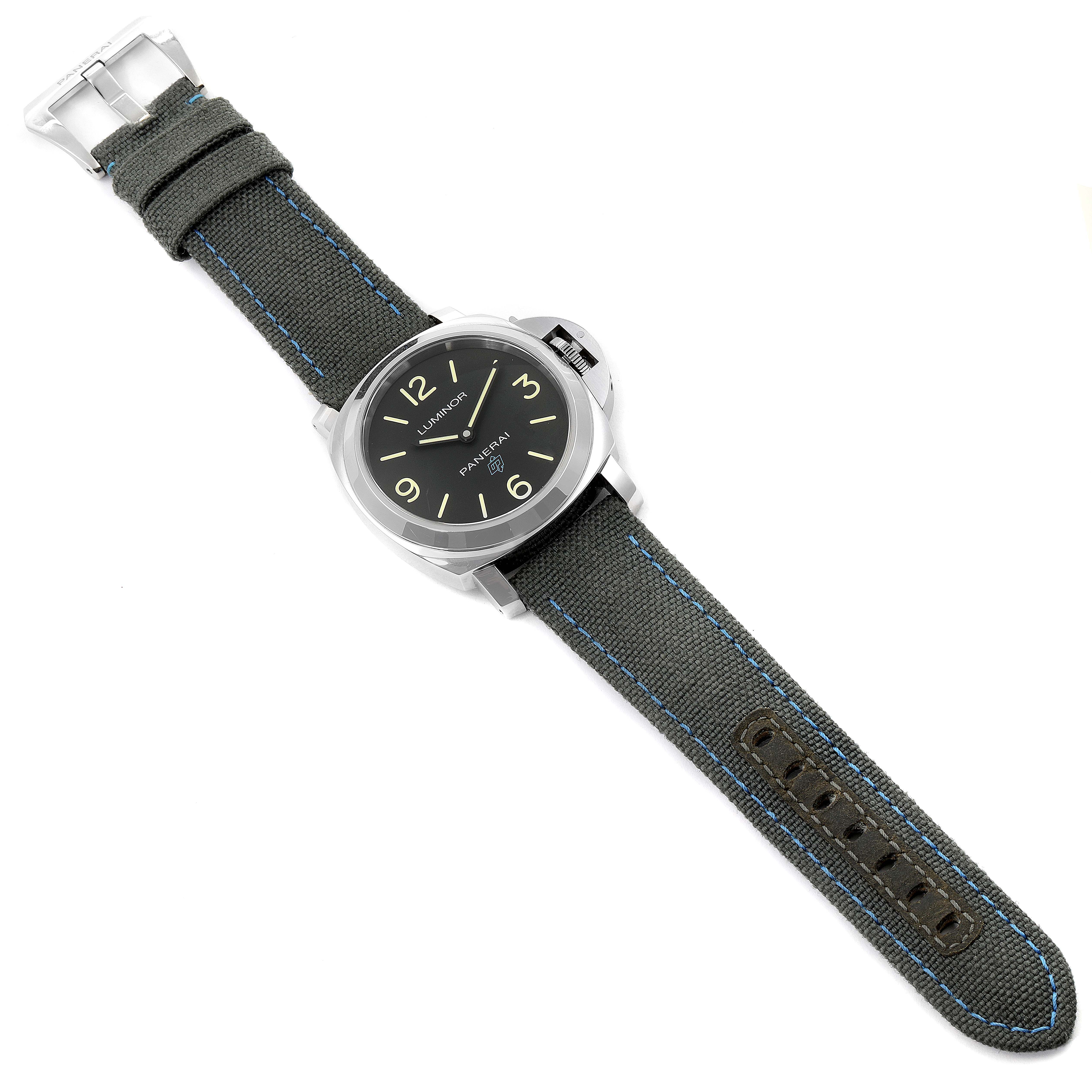 This image shows a top view of a Panerai Luminor PAM00774 Men's Stainless Steel Black Dial PAM00774 Men's Stainless Steel Black Dial watch with a dark fabric strap and visible buckle.