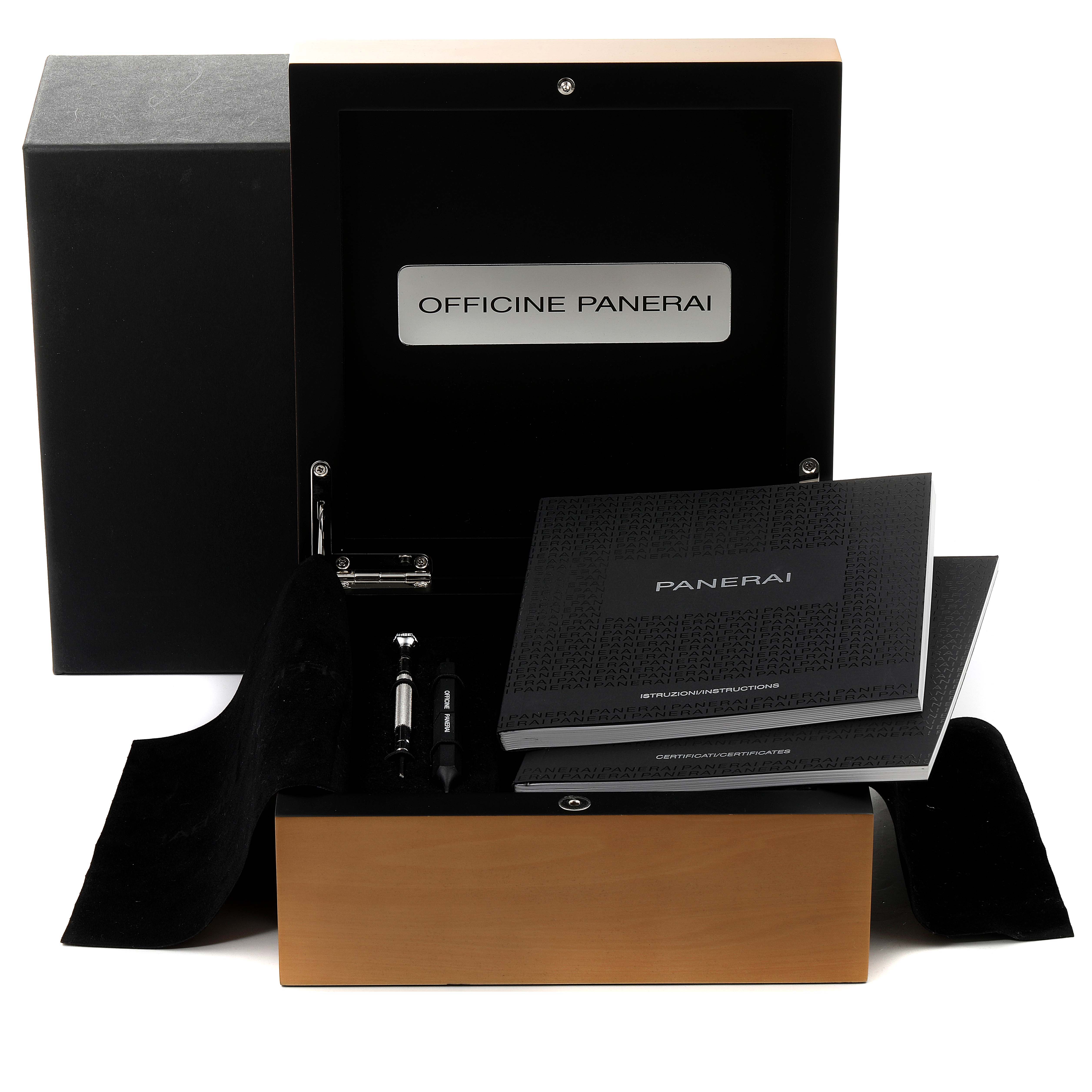 The image shows the storage box of a Panerai Luminor PAM00321 Men
s Stainless Steel Black Dial PAM00321 Men
s Stainless Steel Black Dial watch, including manuals and tools.