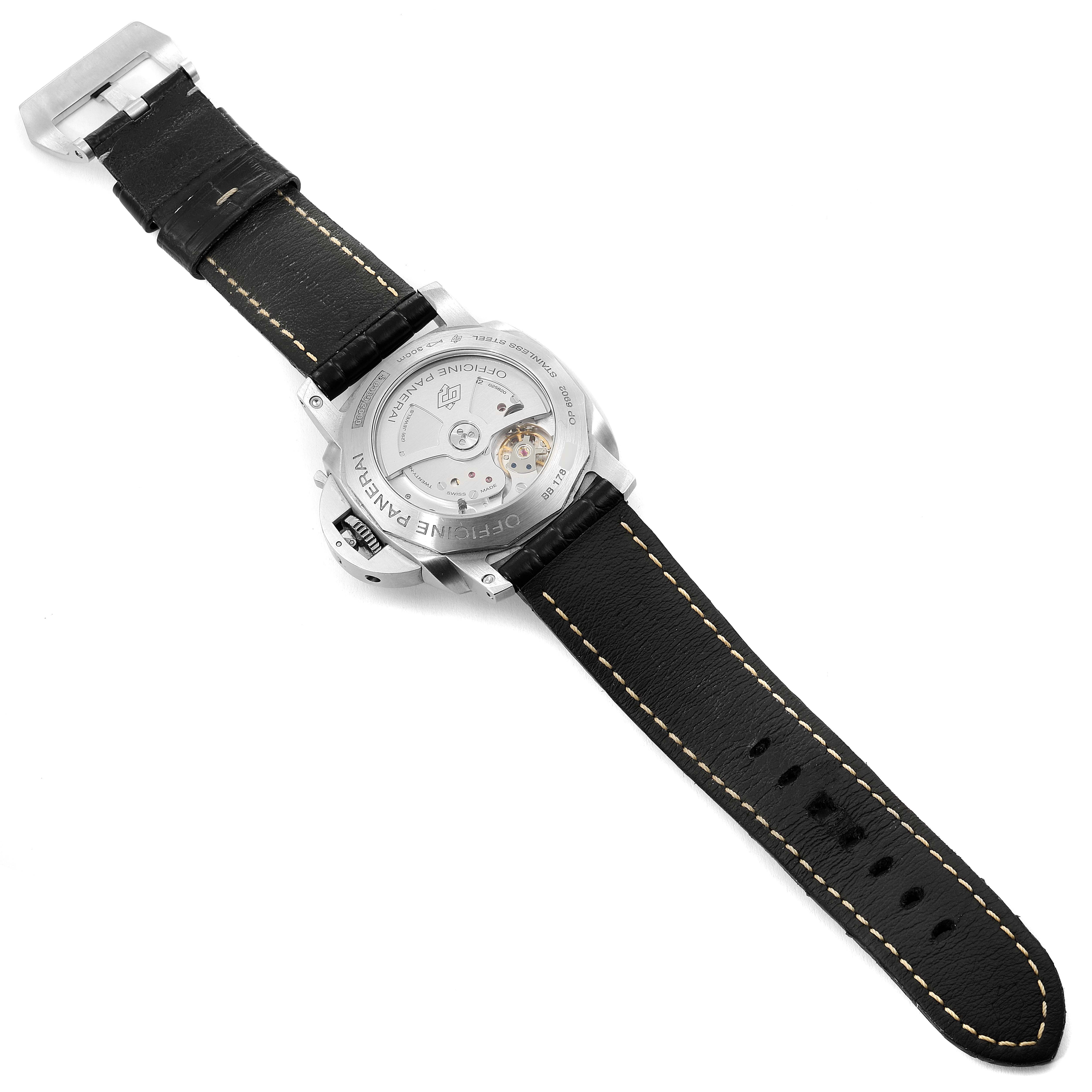 The image shows the back of a Panerai Luminor PAM00321 Men
s Stainless Steel Black Dial PAM00321 Men
s Stainless Steel Black Dial watch, highlighting its black leather strap and transparent case back displaying the movement.