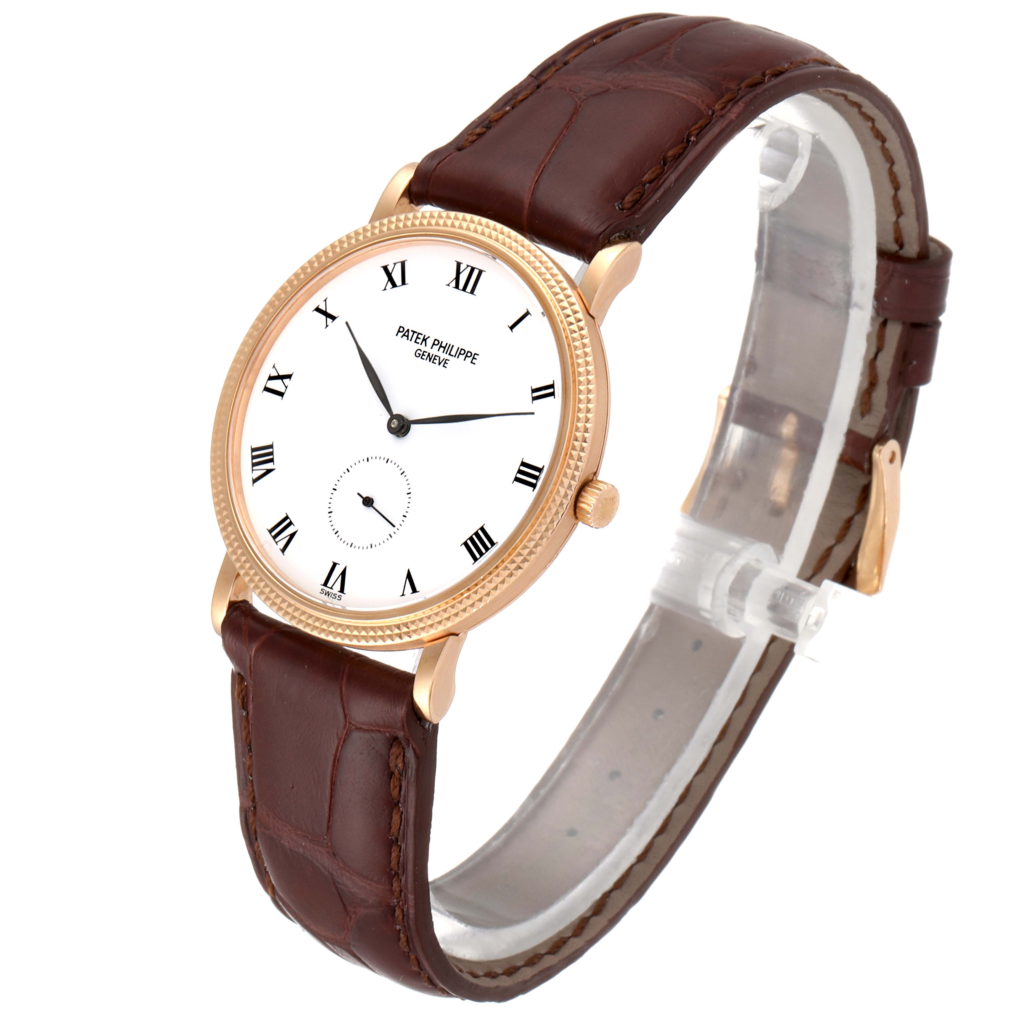 The image shows a Patek Philippe Calatrava 3919R Men
s Rose Gold White Dial 3919R Men
s Rose Gold White Dial watch at a three-quarter angle highlighting its dial, case, and leather strap.