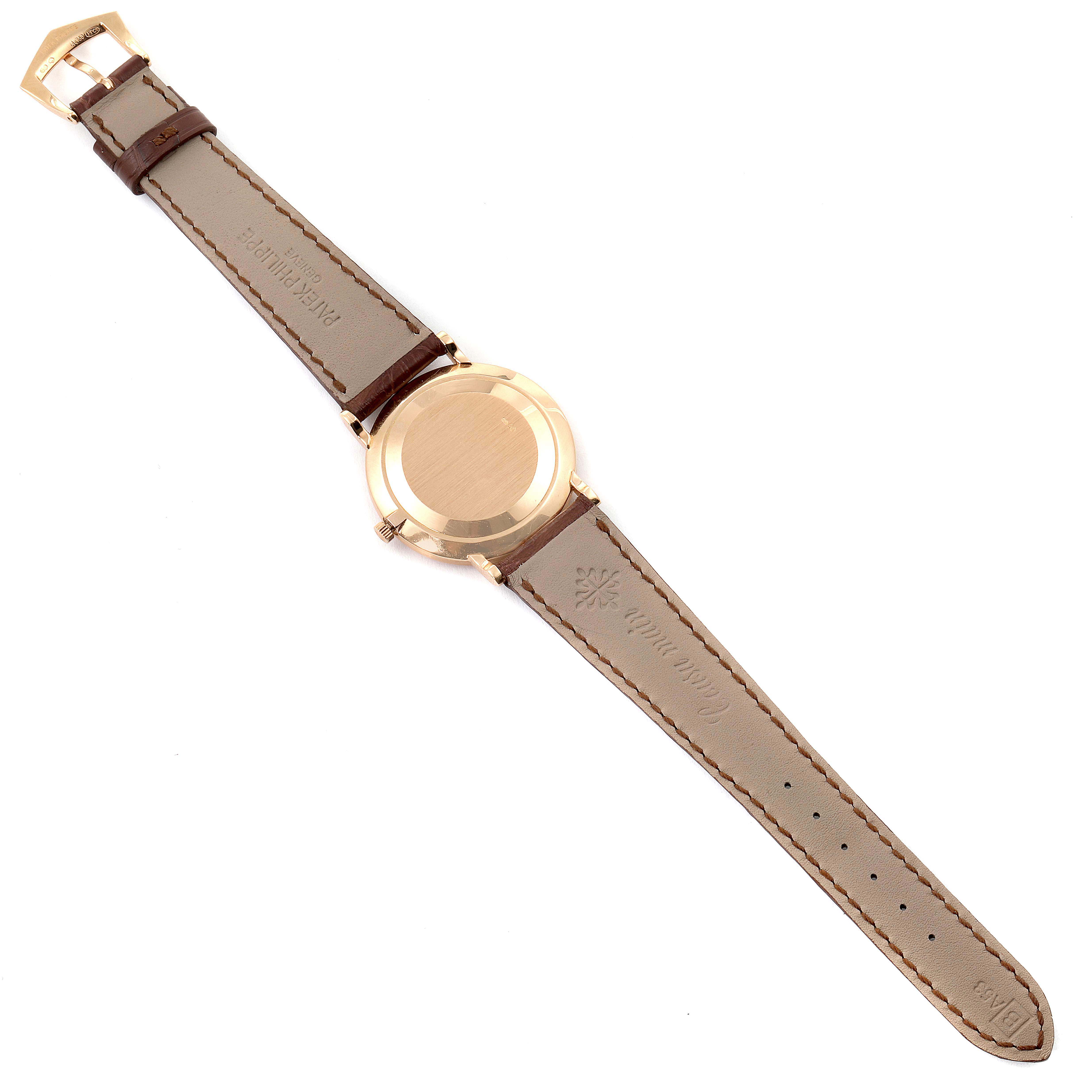 This image shows the back view of a Patek Philippe Calatrava 3919R Men
s Rose Gold White Dial 3919R Men
s Rose Gold White Dial watch, displaying the leather strap and case back.