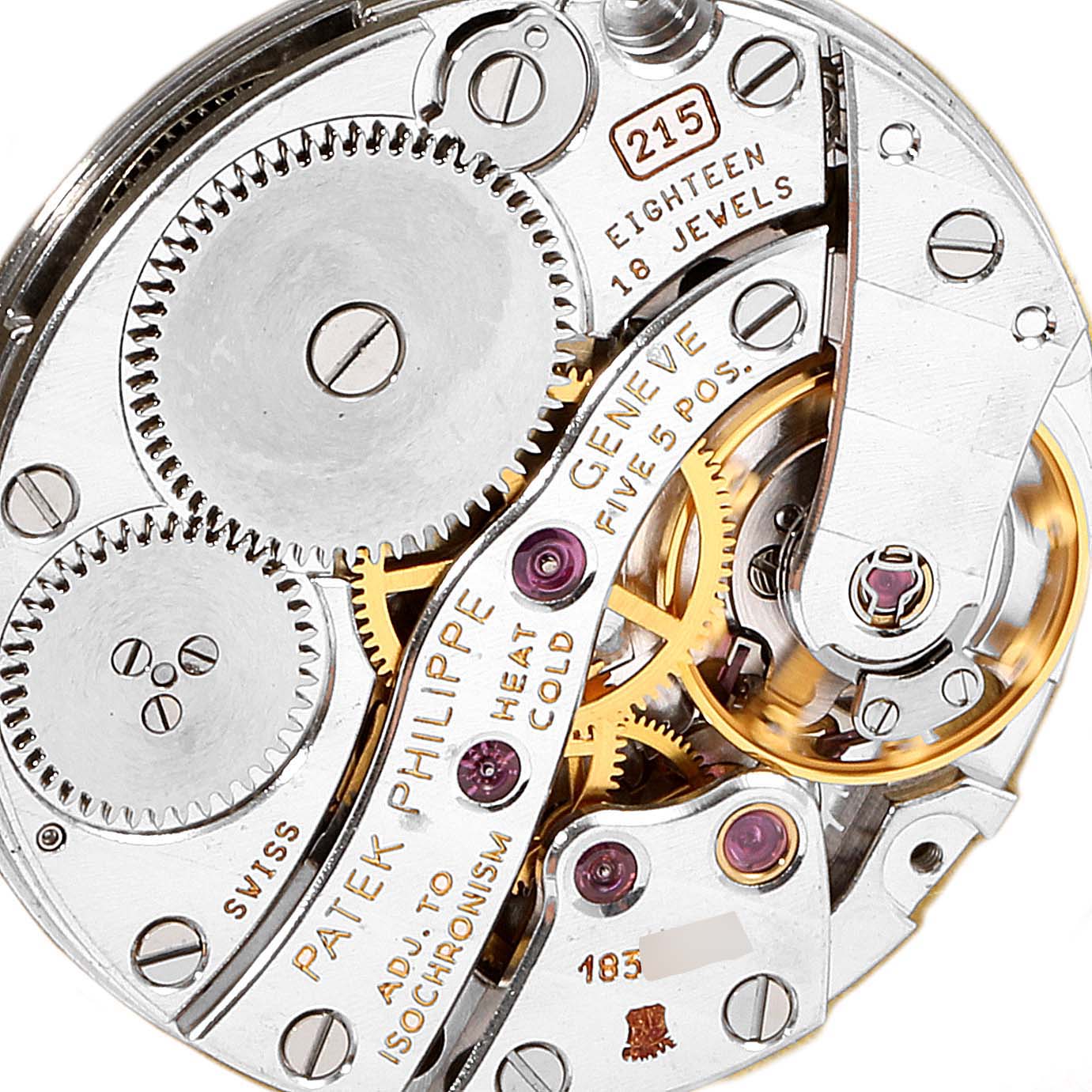 Close-up of the Patek Philippe Calatrava 3919R Men
s Rose Gold White Dial 3919R Men
s Rose Gold White Dial watch movement, showing gears, jewels, and inscriptions.