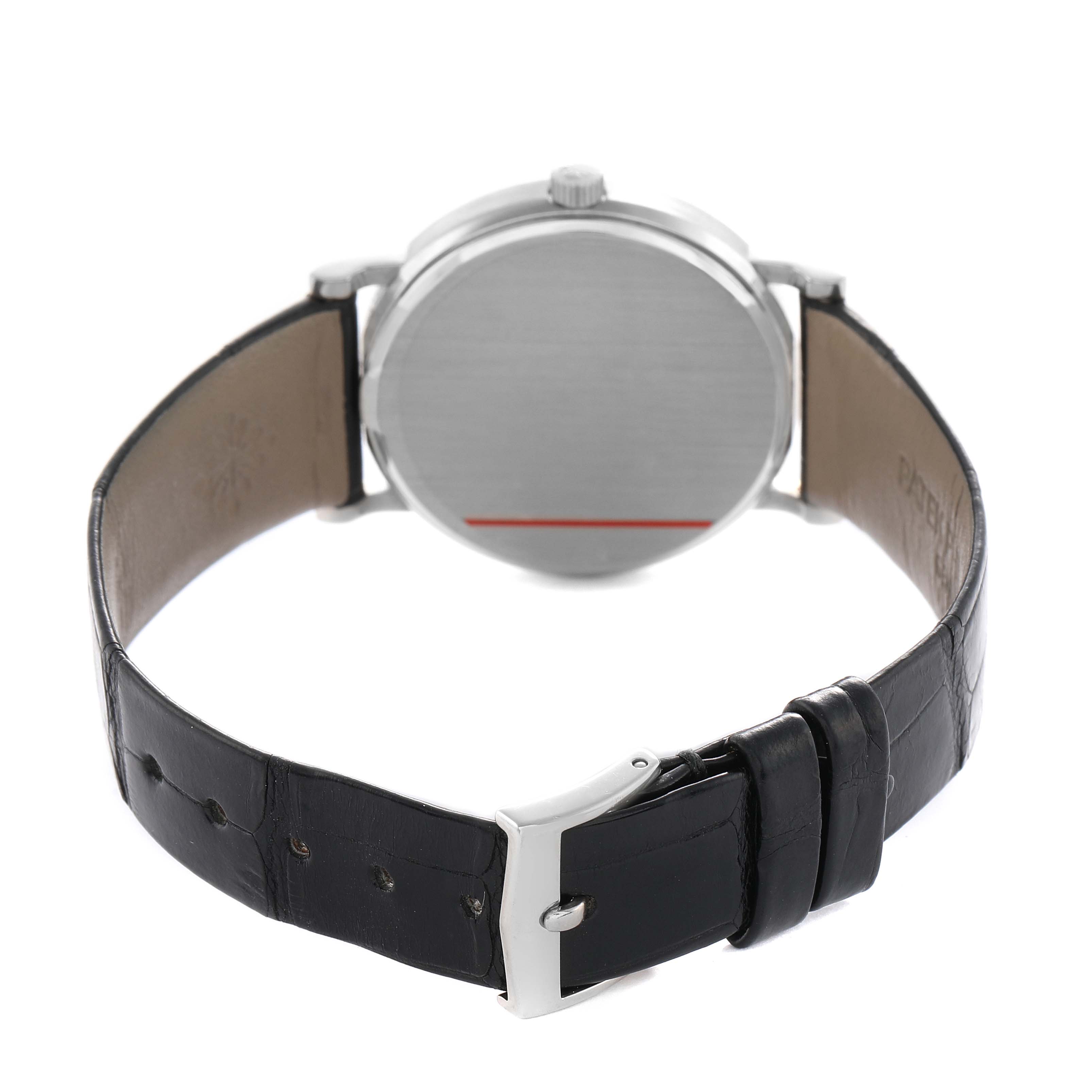 The image shows the back of a Patek Philippe Calatrava 3802/200G-001 Men's White Gold White Dial watch, highlighting the case back, strap, and buckle.