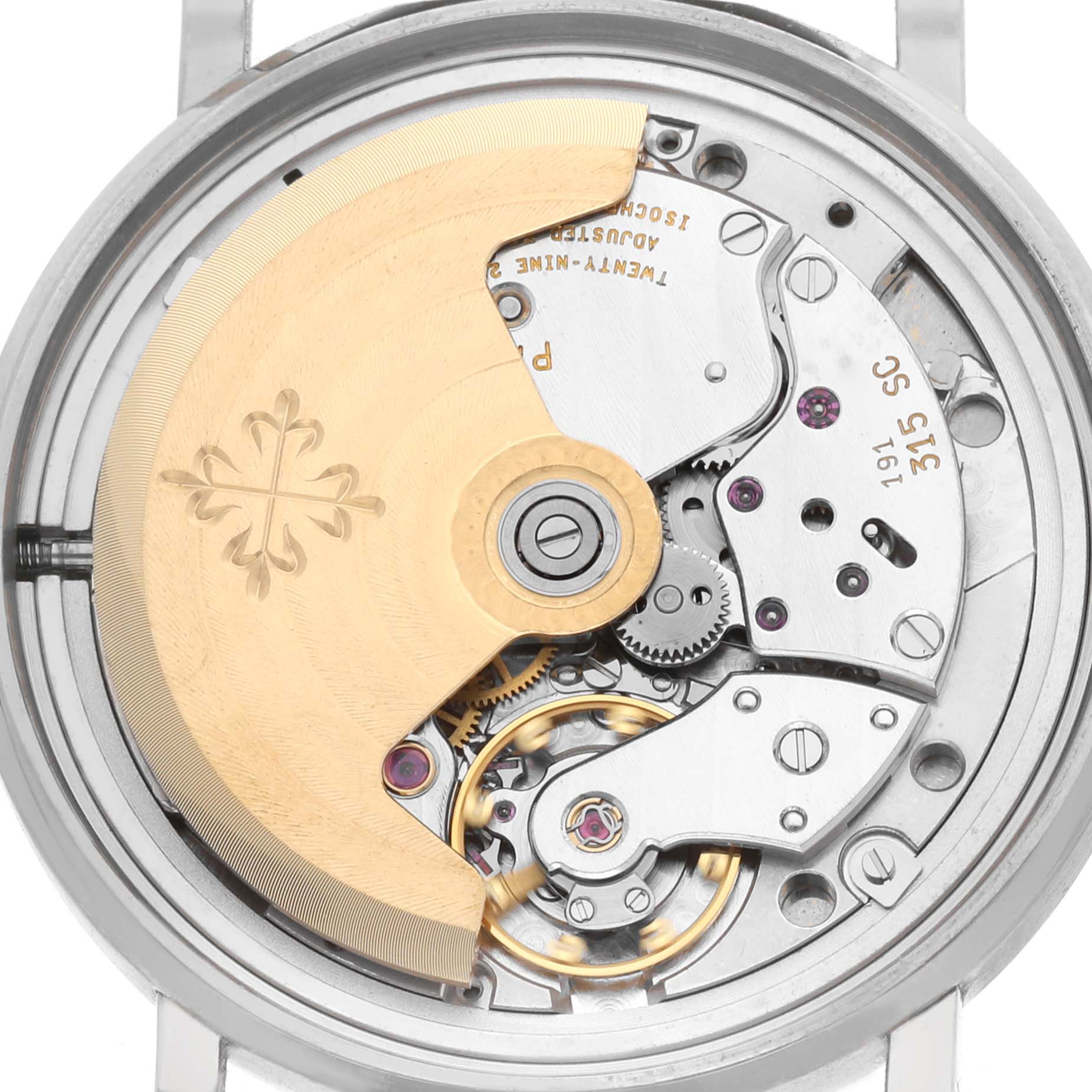 The image shows the back view of a Patek Philippe Calatrava 3802/200G-001 Men's White Gold White Dial, highlighting the rotor and movement mechanics.