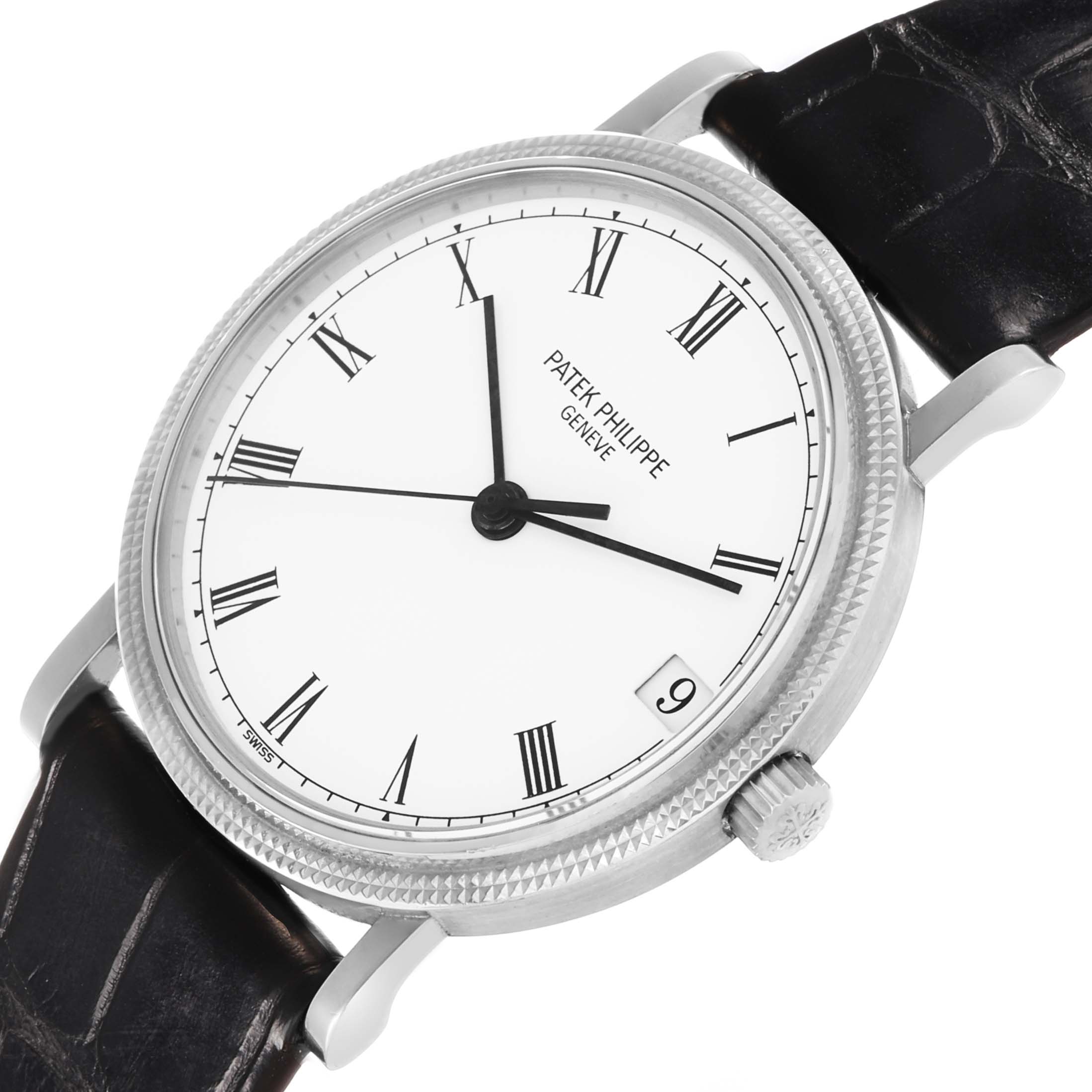 The Patek Philippe Calatrava 3802/200G-001 Men's White Gold White Dial watch is shown at an angle highlighting the face, Roman numerals, bezel, crown, and leather strap.