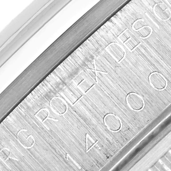 The image shows a close-up of the inner side of the Rolex Air-King 14000 Men's Stainless Steel Blue Dial 14000 Men's Stainless Steel Blue Dial watch with engraved text.