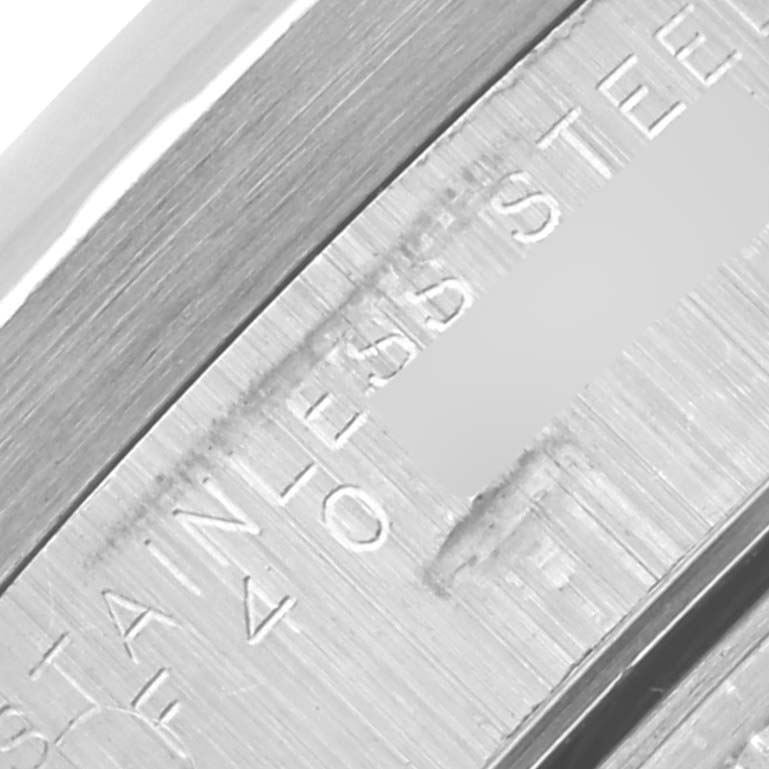 The image shows a close-up of the bezel on the Rolex Air-King 14010 Men's Stainless Steel Blue Dial 14010 Men's Stainless Steel Blue Dial, highlighting the "STAINLESS STEEL" engraving.