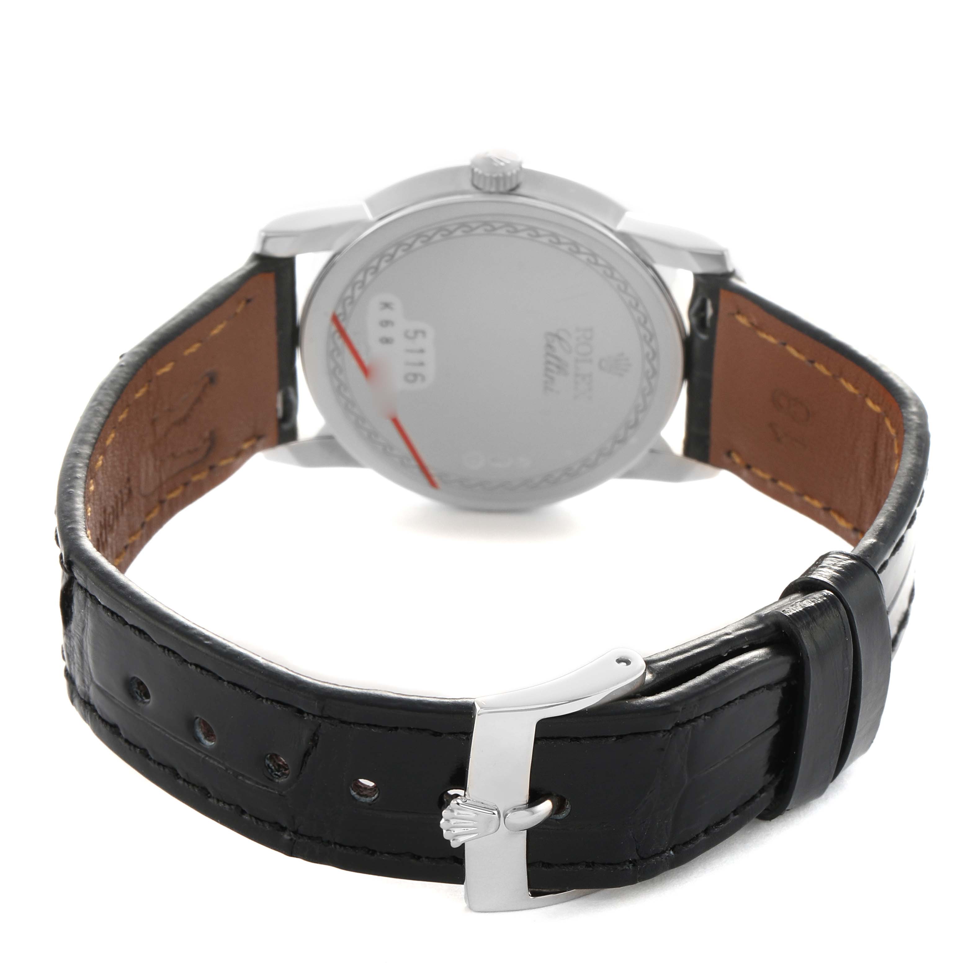 The image shows the back of the Rolex Cellini 5116/9 Men's White Gold White Dial watch, focusing on its case back and black leather strap with buckle.