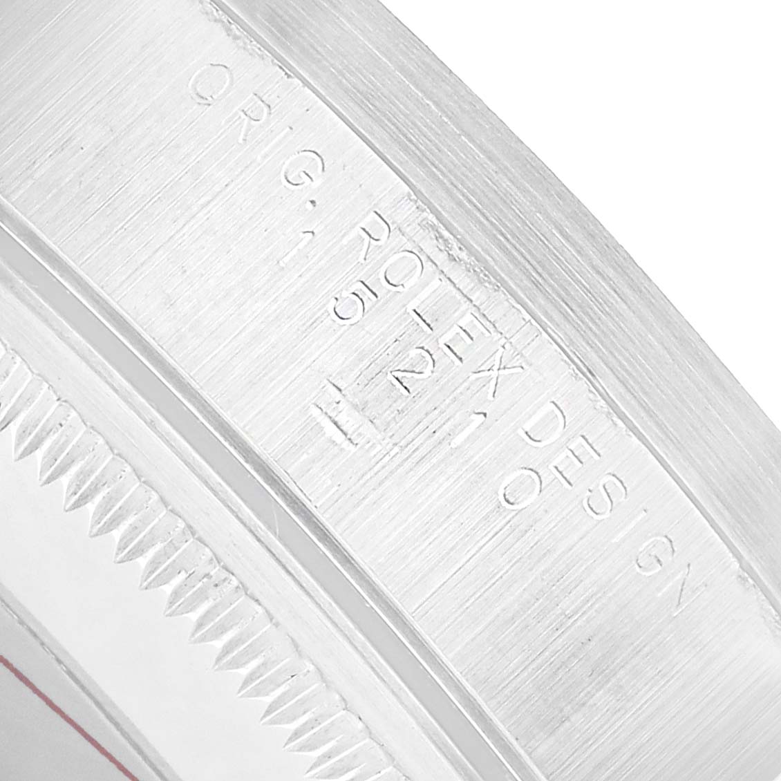 The image shows a close-up of the edge and engravings on the case of a Rolex Date 15210 Men's Stainless Steel Black Dial model.