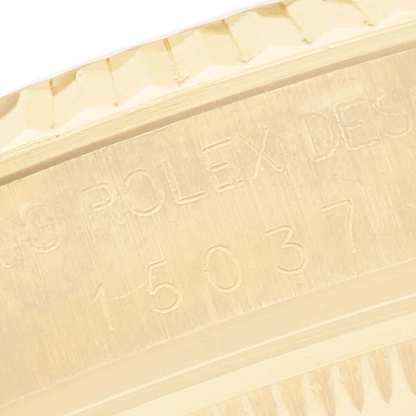 The image shows a close-up of the case side with engraving on the Rolex Date 15037 Men's Yellow Gold White Dial 15037 Men's Yellow Gold White Dial model.