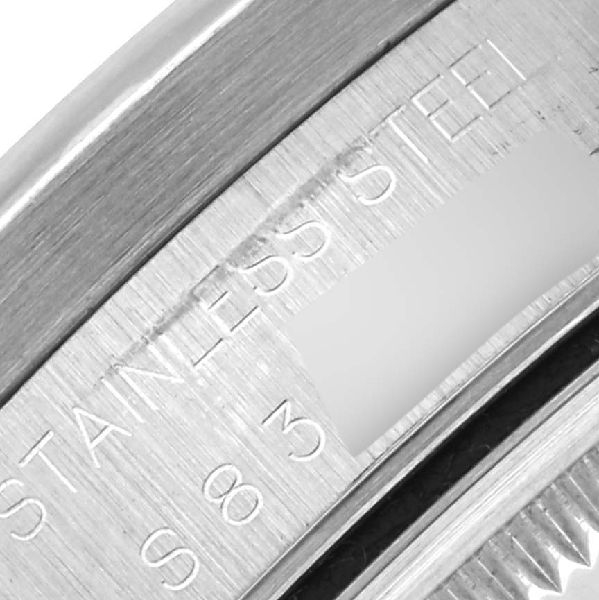 The close-up image shows the outer rim and engraved text of the Rolex Date 15210 Men
s Stainless Steel White Dial 15210 Men
s Stainless Steel White Dial model watch case back.
