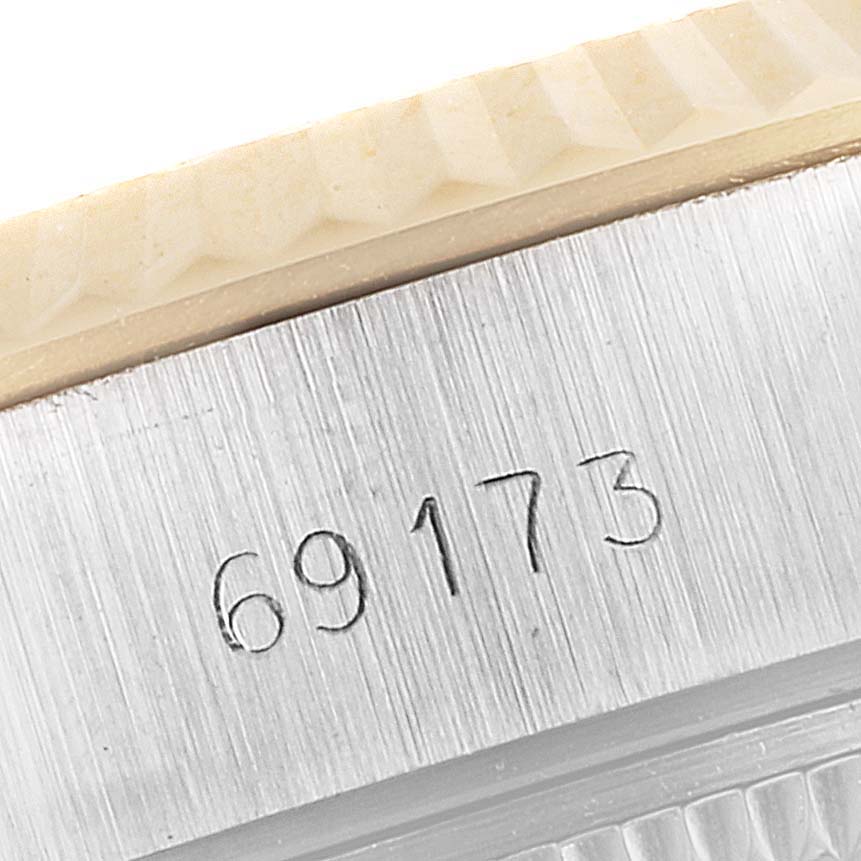 This close-up shows the model number "69173" engraved on the case of a Rolex Datejust 69173 Women
s Steel and Gold (two tone) Champagne Dial 69173 Women
s Steel and Gold (two tone) Champagne Dial watch.
