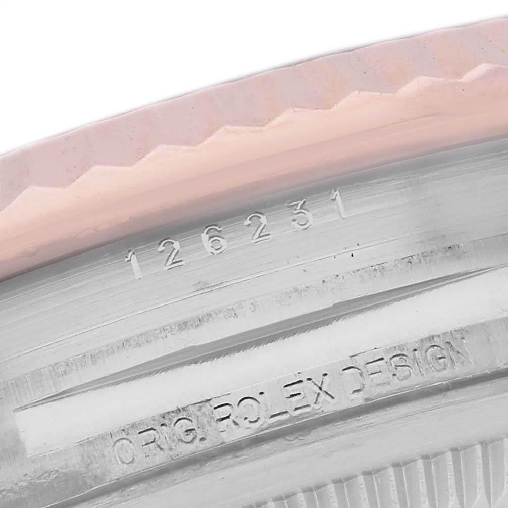 The image shows the side angle of a Rolex Datejust 126231 Men's Steel and Gold (two tone) Grey Dial 126231 Men's Steel and Gold (two tone) Grey Dial watch bezel with engraved markings.