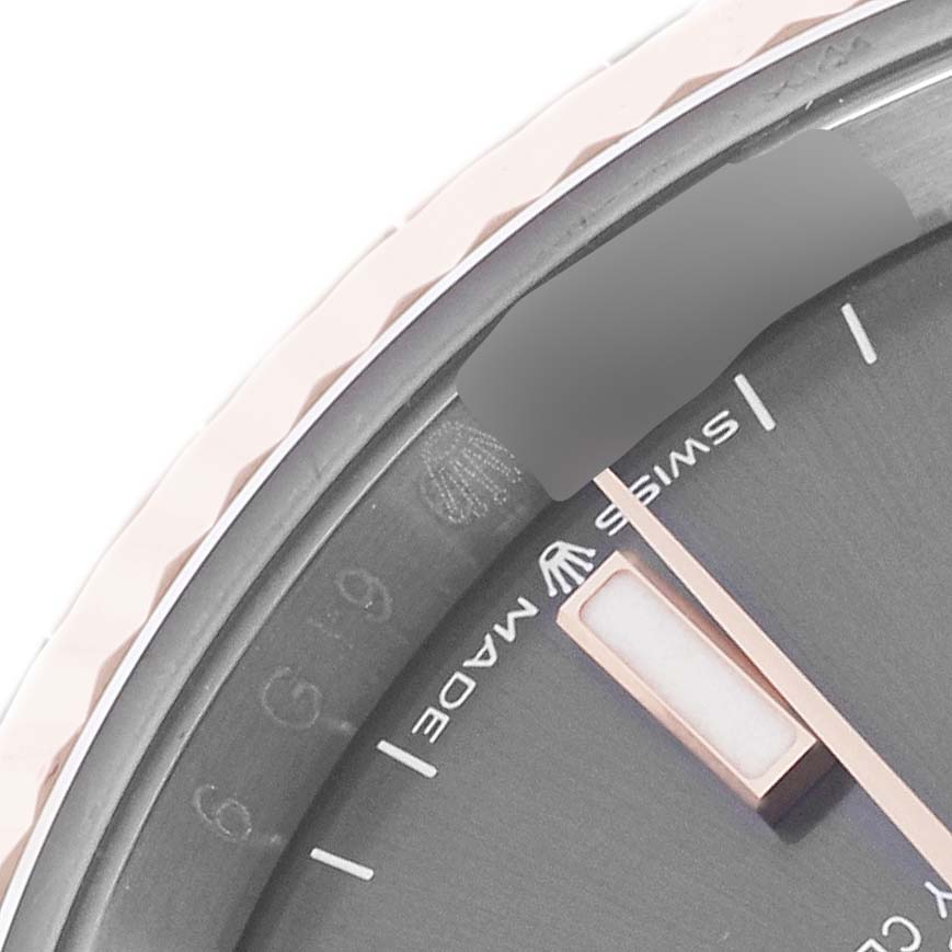 The image shows a close-up of the dial and bezel of a Rolex Datejust 126231 Men's Steel and Gold (two tone) Grey Dial 126231 Men's Steel and Gold (two tone) Grey Dial watch, highlighting the markings and watch hand.