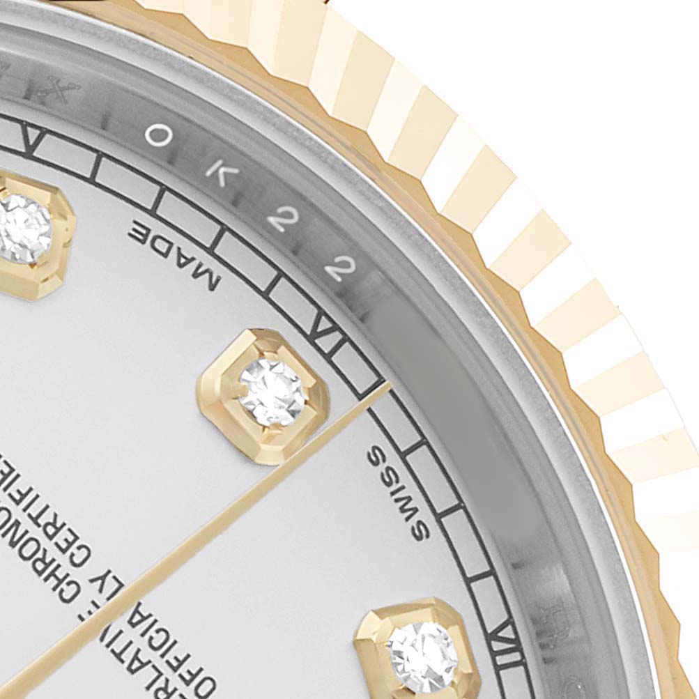 The image shows a close-up of the dial, diamonds, and bezel of a Rolex Datejust 41 116333 Men's Steel and Gold (two tone) Silver Dial, featuring the "SWISS MADE" text.