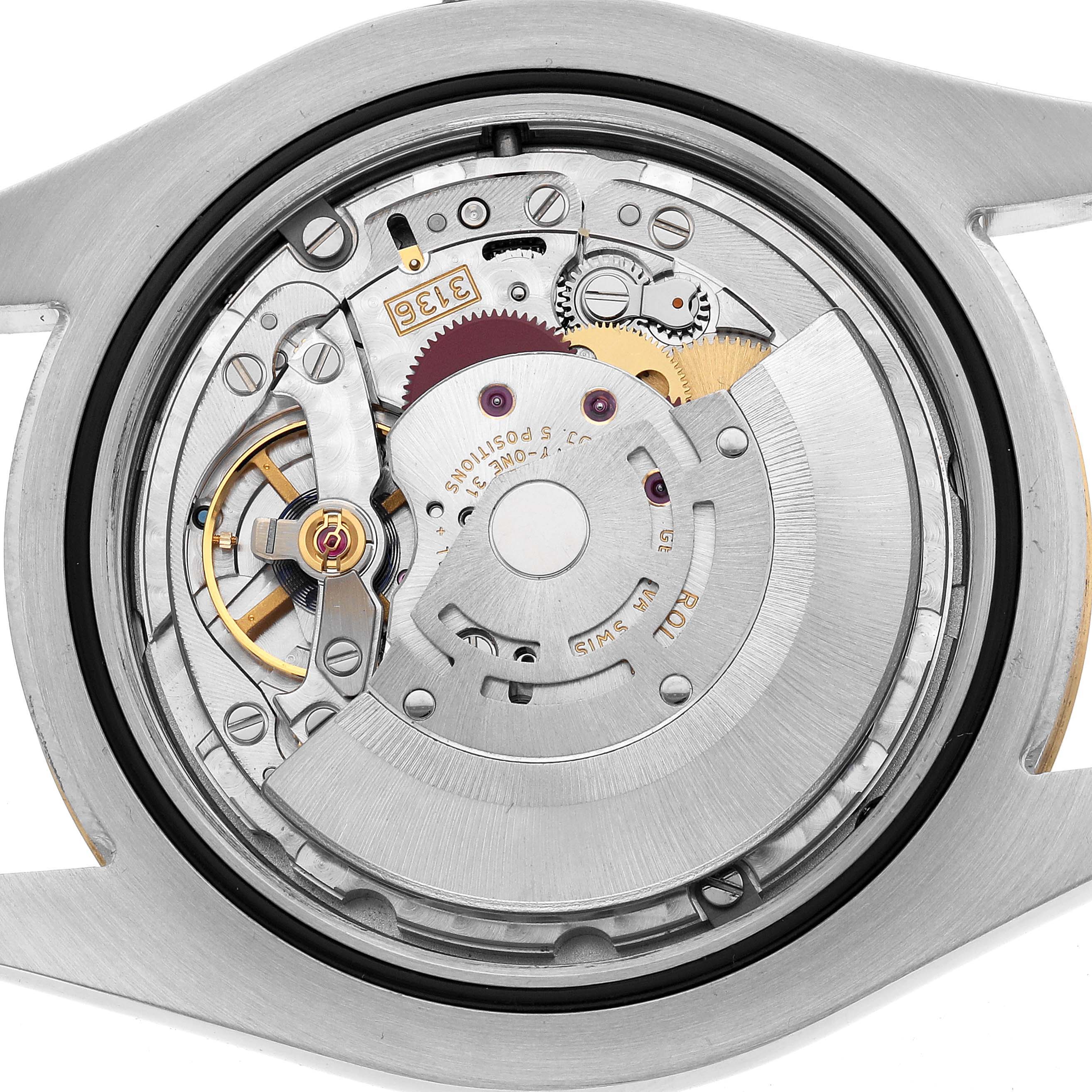The image shows the back view of a Rolex Datejust 41 116333 Men's Steel and Gold (two tone) Silver Dial, focusing on its intricate movement and components.