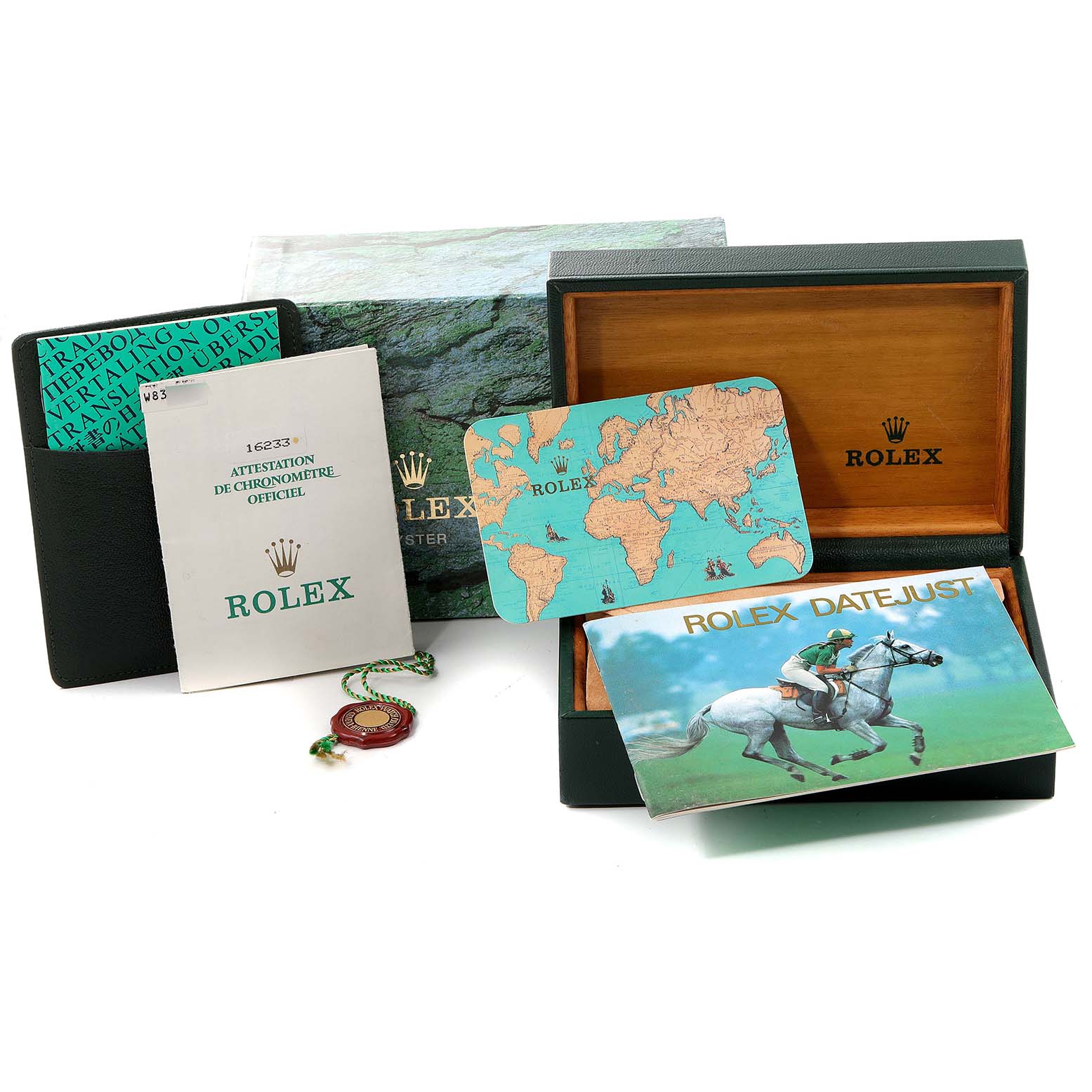 Accessories for the Rolex Datejust 16233 Men's Steel and Gold (two tone) Mother of Pearl Dial 16233 Men's Steel and Gold (two tone) Mother of Pearl Dial include the presentation box, manuals, a map card, and a guarantee seal.