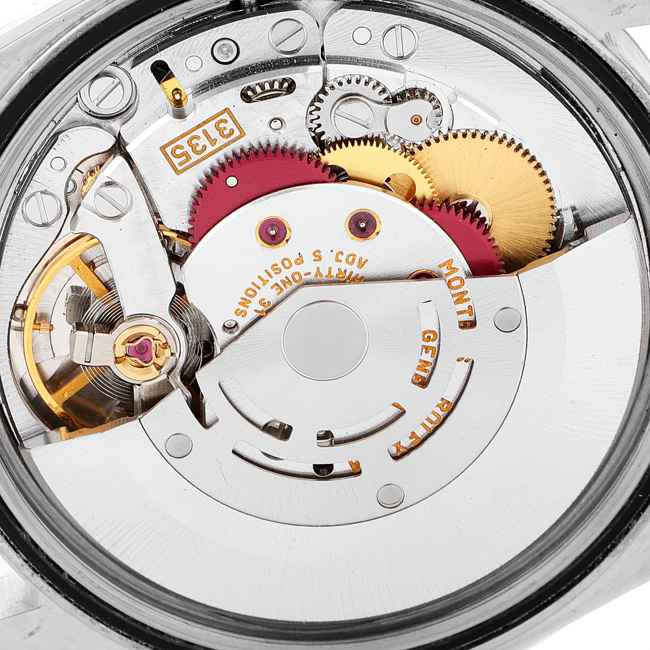 This is a detailed image showing the movement and internal mechanism of a Rolex Datejust 16233 Men's Steel and Gold (two tone) Mother of Pearl Dial 16233 Men's Steel and Gold (two tone) Mother of Pearl Dial watch.