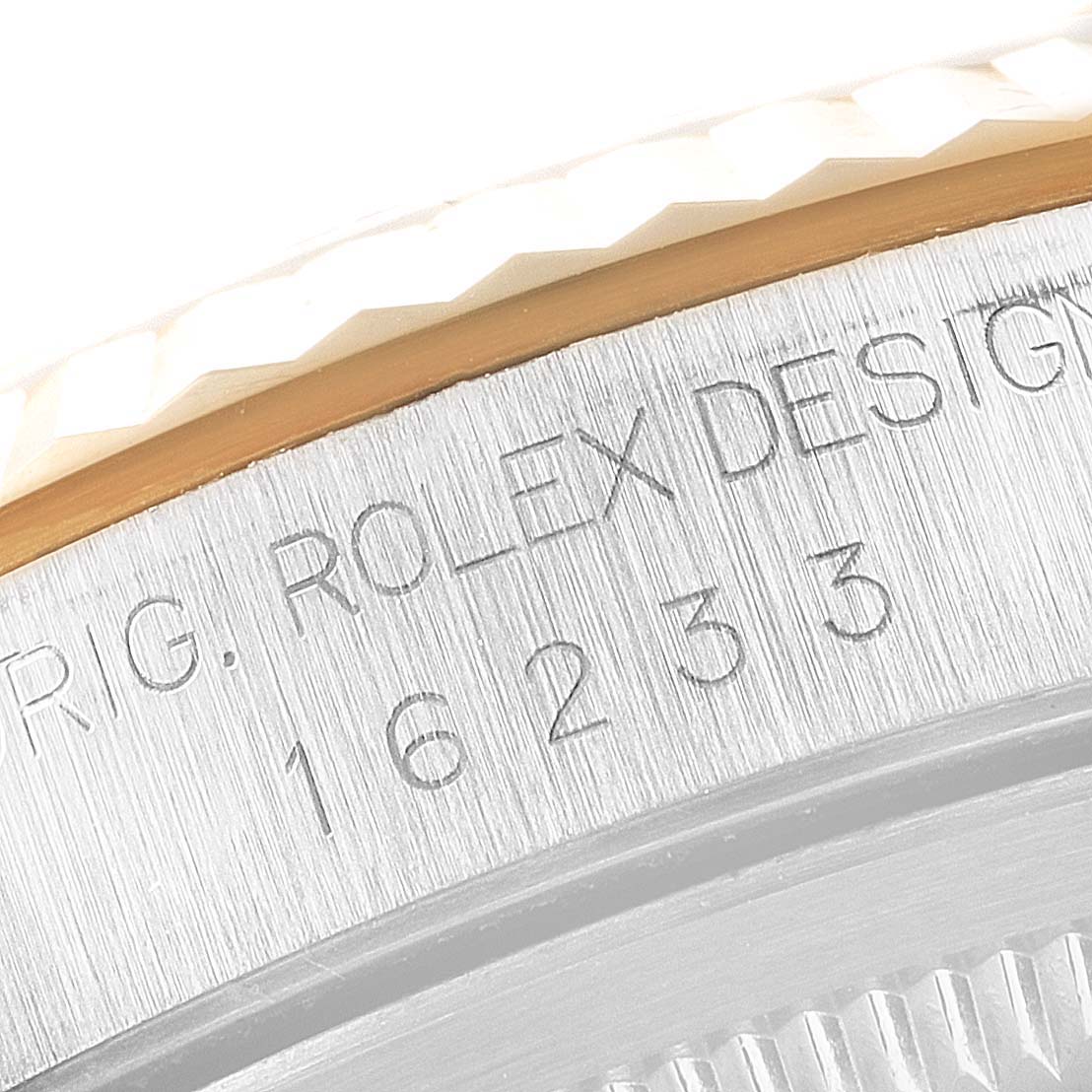 This close-up image shows the engraving on the caseback of a Rolex Datejust 16233 Men's Steel and Gold (two tone) Mother of Pearl Dial 16233 Men's Steel and Gold (two tone) Mother of Pearl Dial watch.
