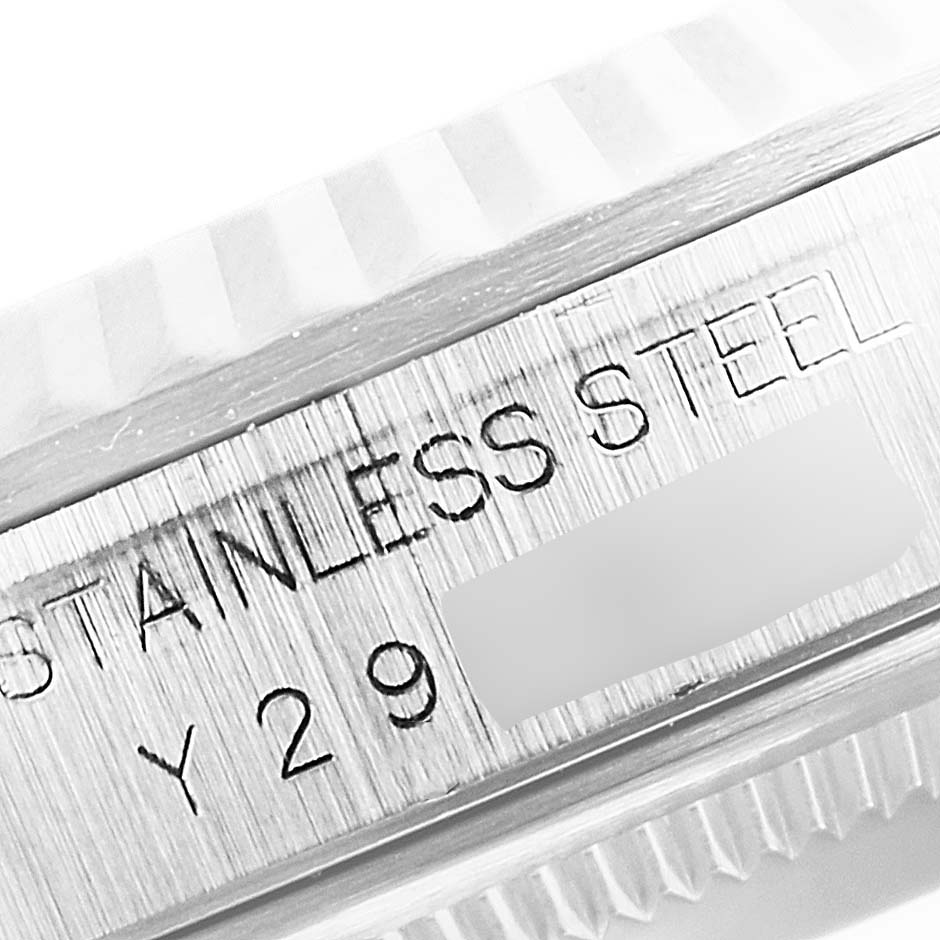 This image shows a close-up of the stainless steel case and serial number of a Rolex Datejust 16234 Men's Stainless Steel Silver Dial 16234 Men's Stainless Steel Silver Dial watch.