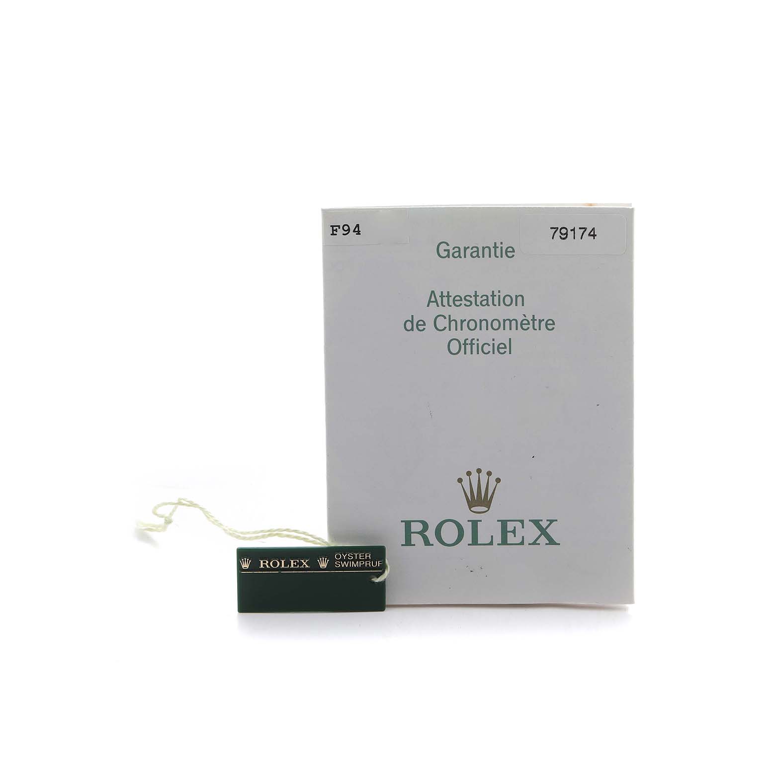 The image shows a warranty card and a Rolex tag for the Datejust model with a frontal view.