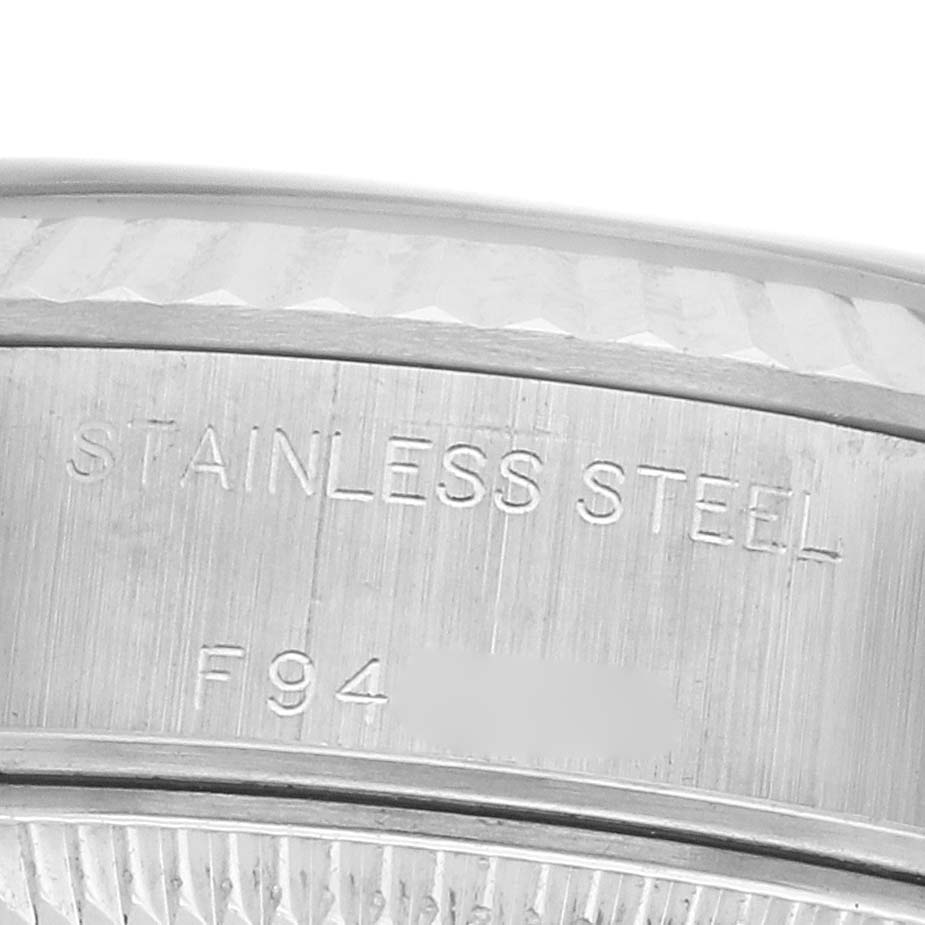 The image shows a close-up of the side engraving on a Rolex Datejust 79174 Women's Stainless Steel Mother of Pearl Dial watch case indicating "STAINLESS STEEL."