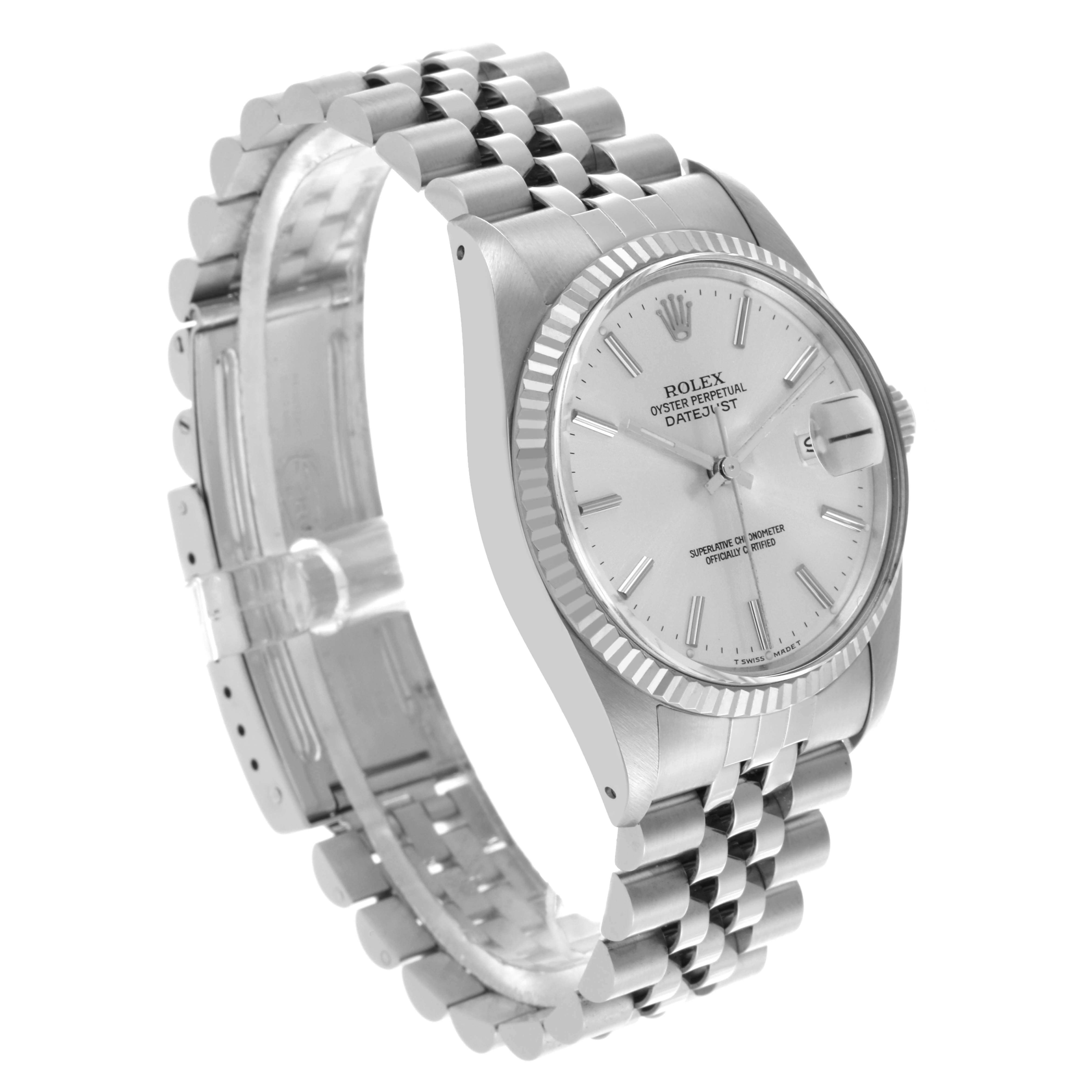The Rolex Datejust 16014 Men's Stainless Steel Silver Dial 16014 Men's Stainless Steel Silver Dial watch is shown at an angle displaying the face, bezel, and part of the bracelet.