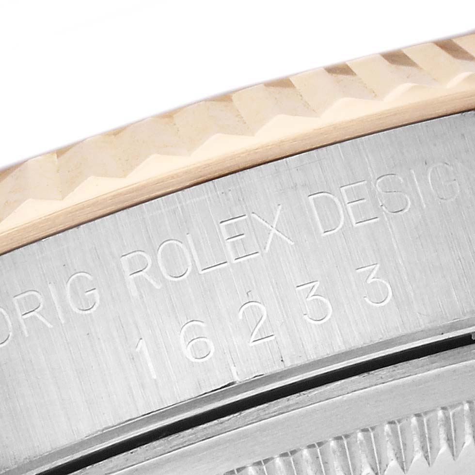 The image shows a close-up of the case side and the engraved model number of the Rolex Datejust 16233 Men's Steel and Gold (two tone) Black Dial 16233 Men's Steel and Gold (two tone) Black Dial.
