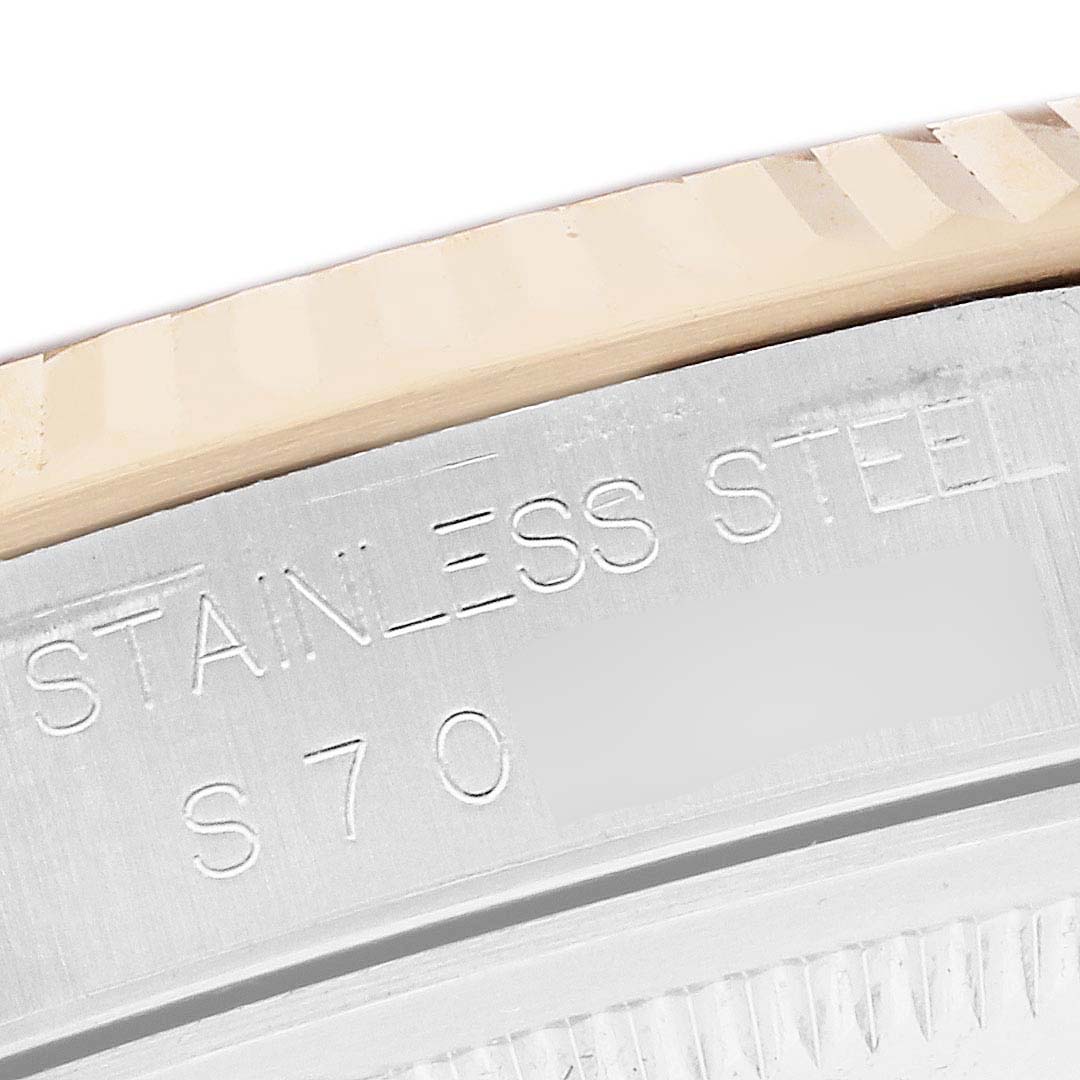 This image shows a close-up of the engraving on the bezel of a Rolex Datejust 16233 Men's Steel and Gold (two tone) Black Dial 16233 Men's Steel and Gold (two tone) Black Dial, highlighting "STAINLESS STEEL."