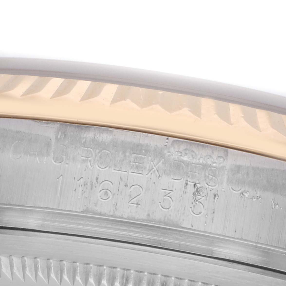 The image shows a close-up angle of the bezel and engraved model number on the case side of a Rolex Datejust 116233 Men's Steel and Gold (two tone) White Dial watch.