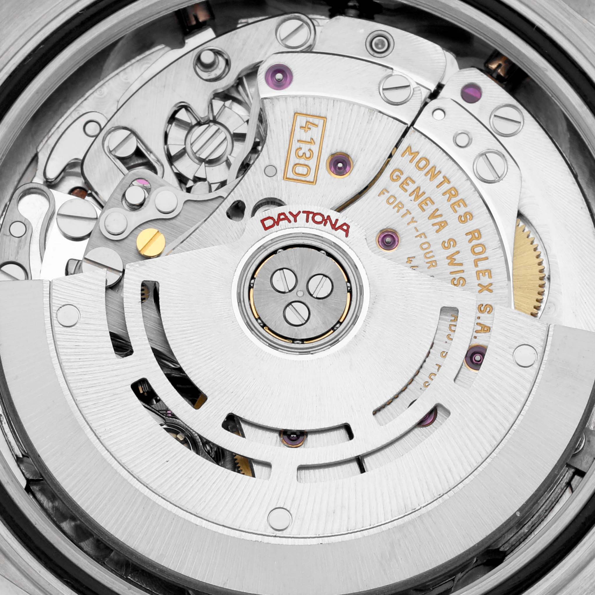 The image shows the intricate movement of a Rolex Daytona 116519 Men's White Gold White Dial 116519 Men's White Gold White Dial watch, displaying gears and internal components.