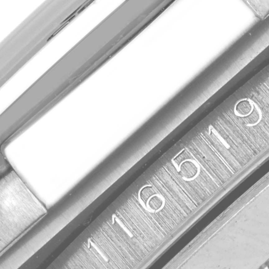 The image shows a close-up of the side of a Rolex Daytona 116519 Men's White Gold White Dial 116519 Men's White Gold White Dial with its model number engraved.