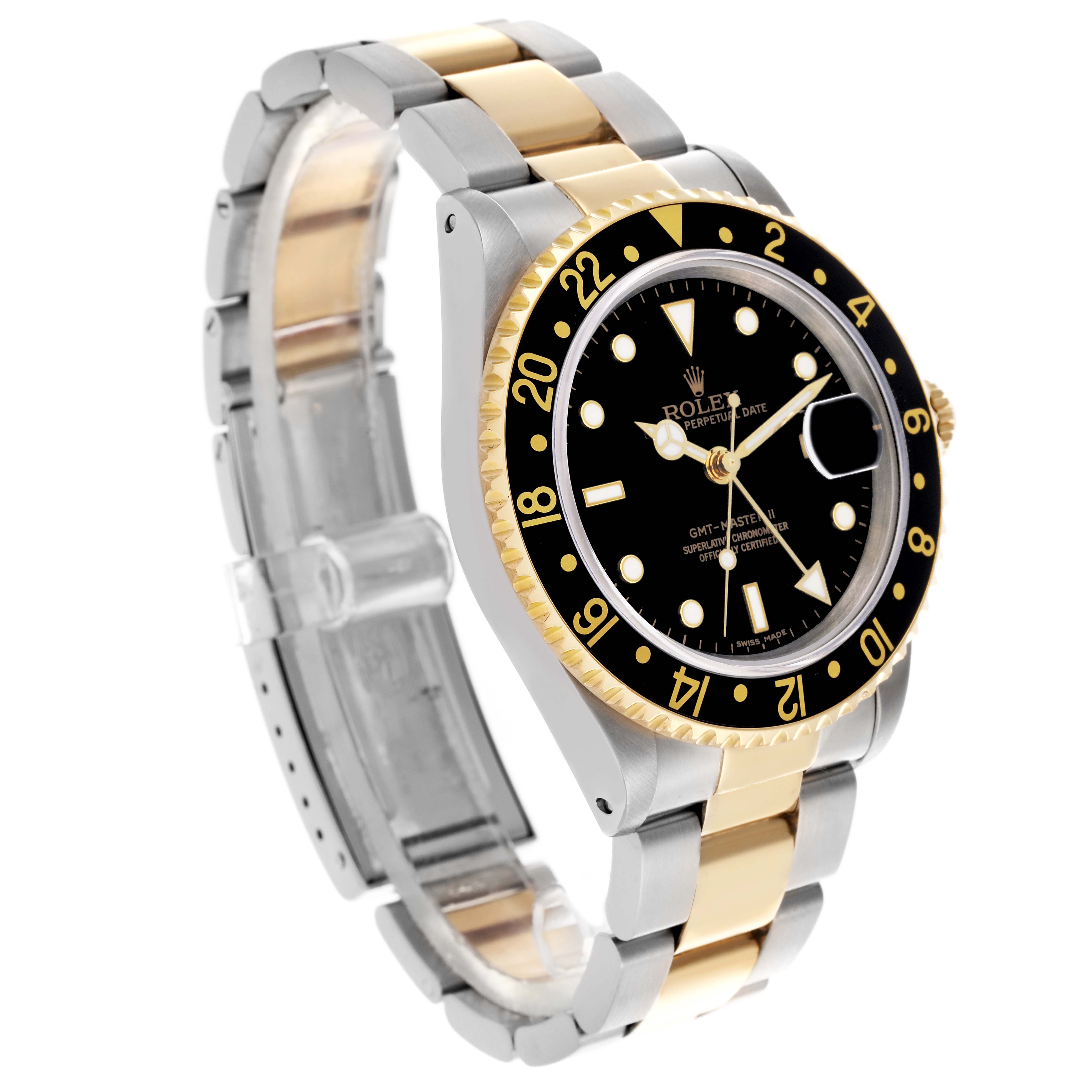 The Rolex GMT-Master 16713 Men's Steel and Gold (two tone) Black Dial 16713 Men's Steel and Gold (two tone) Black Dial watch is shown at an angled side view, highlighting the black bezel, dial, and two-tone bracelet.