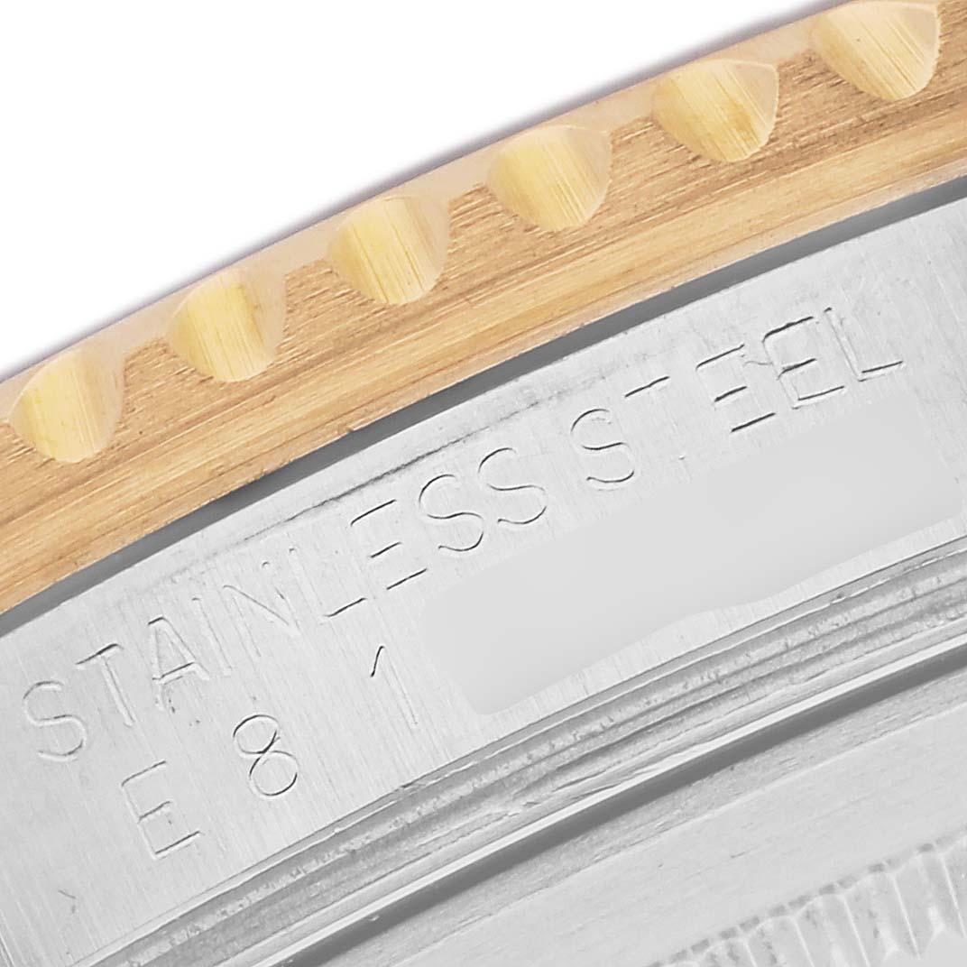 The image shows a close-up of the Rolex GMT-Master 16713 Men's Steel and Gold (two tone) Black Dial 16713 Men's Steel and Gold (two tone) Black Dial's case back, highlighting the edge with "Stainless Steel" engraving.