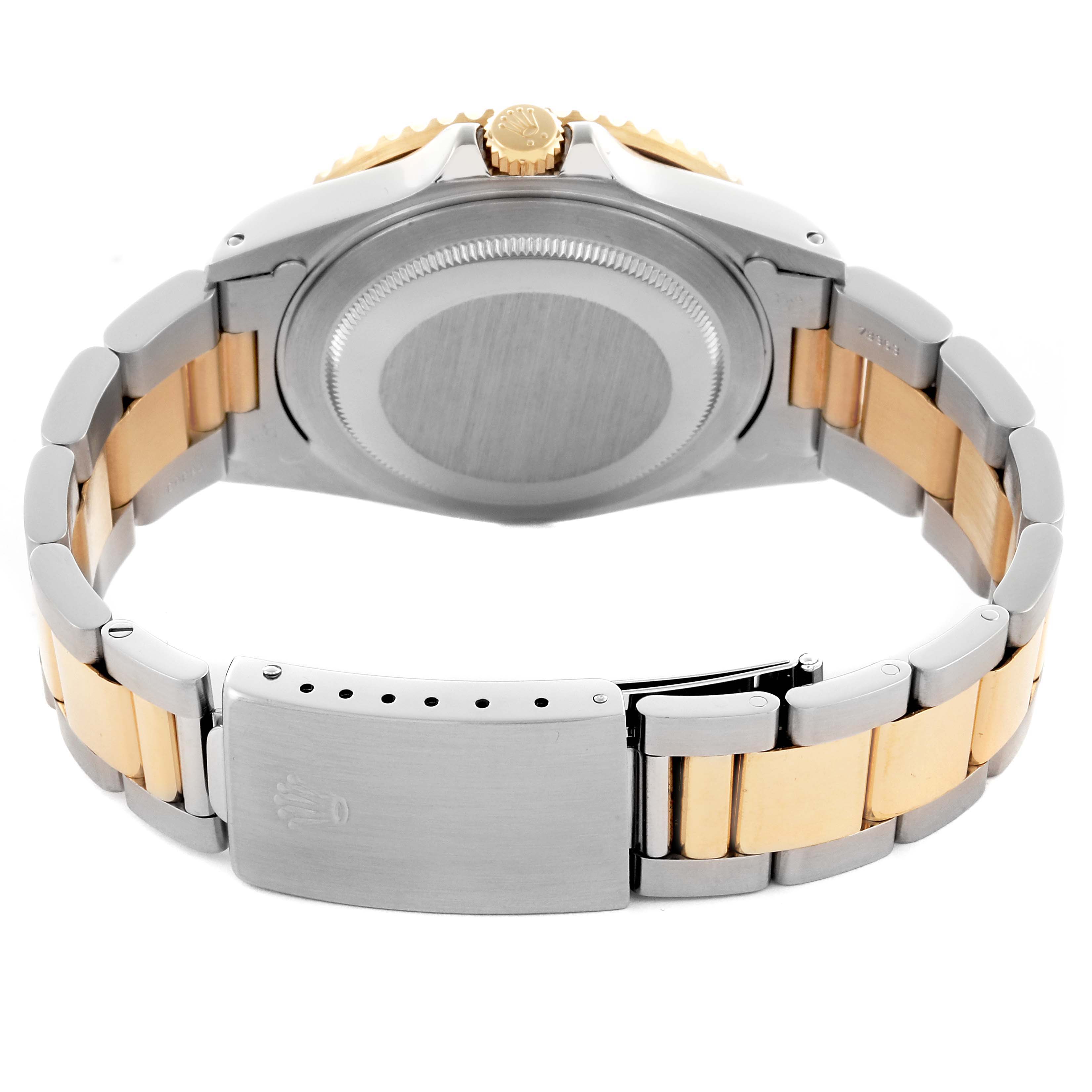 The image shows the back and side of the Rolex GMT-Master 16713 Men's Steel and Gold (two tone) Black Dial 16713 Men's Steel and Gold (two tone) Black Dial watch, highlighting its bracelet and clasp.