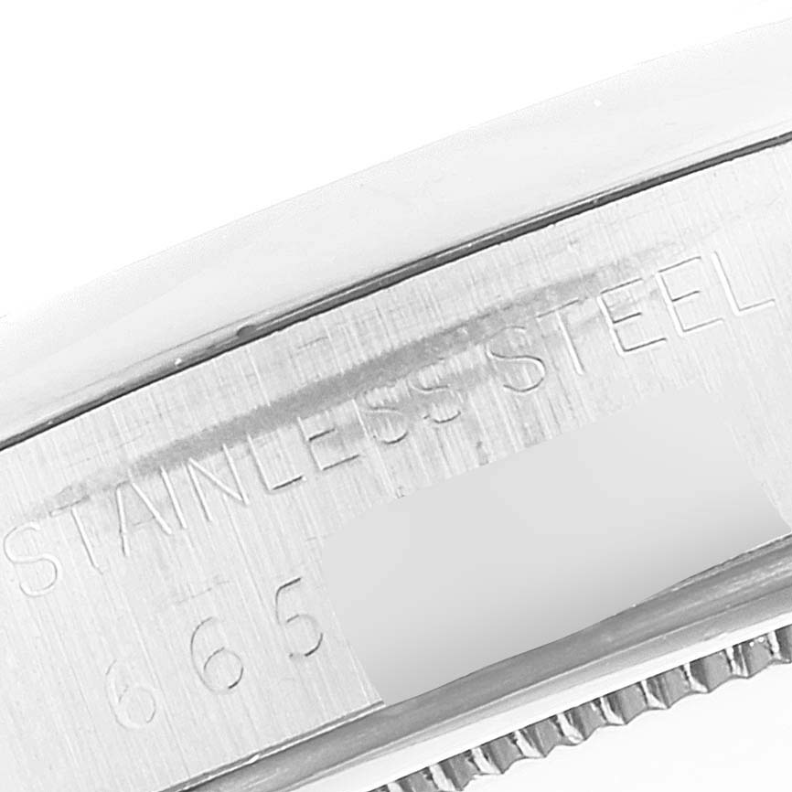 This image shows a close-up of the side engraving on a Rolex Vintage Collection 6694 Men
s Stainless Steel Silver Dial 6694 Men
s Stainless Steel Silver Dial watch, highlighting the "Stainless Steel" marking.