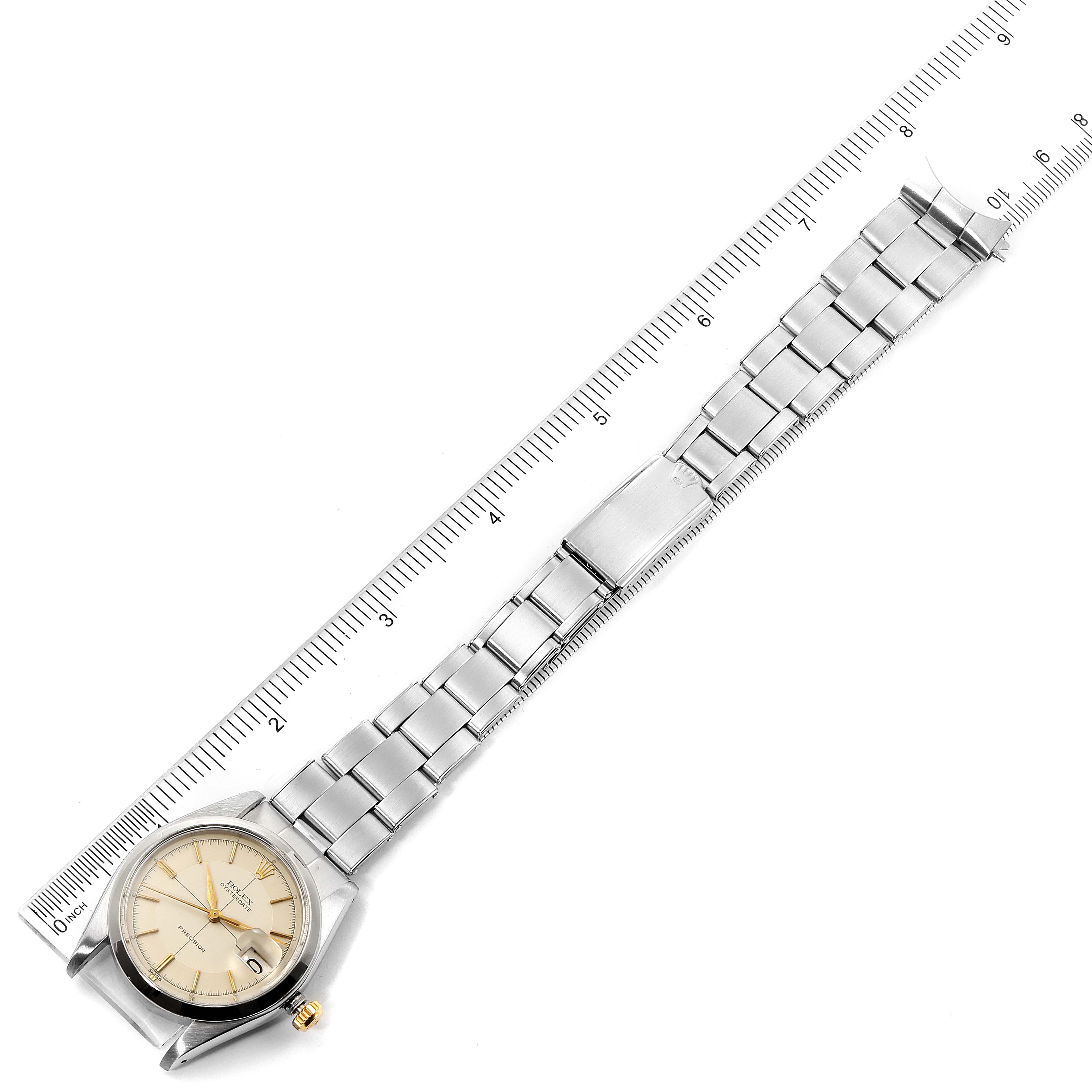 The image shows a Vintage Collection Rolex watch laid flat, fully extended with a ruler for size reference.