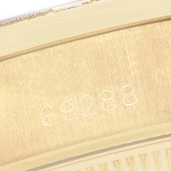 This close-up image shows the model number engraving on a Rolex President 69288 Women's Yellow Gold Black Dial watch case.