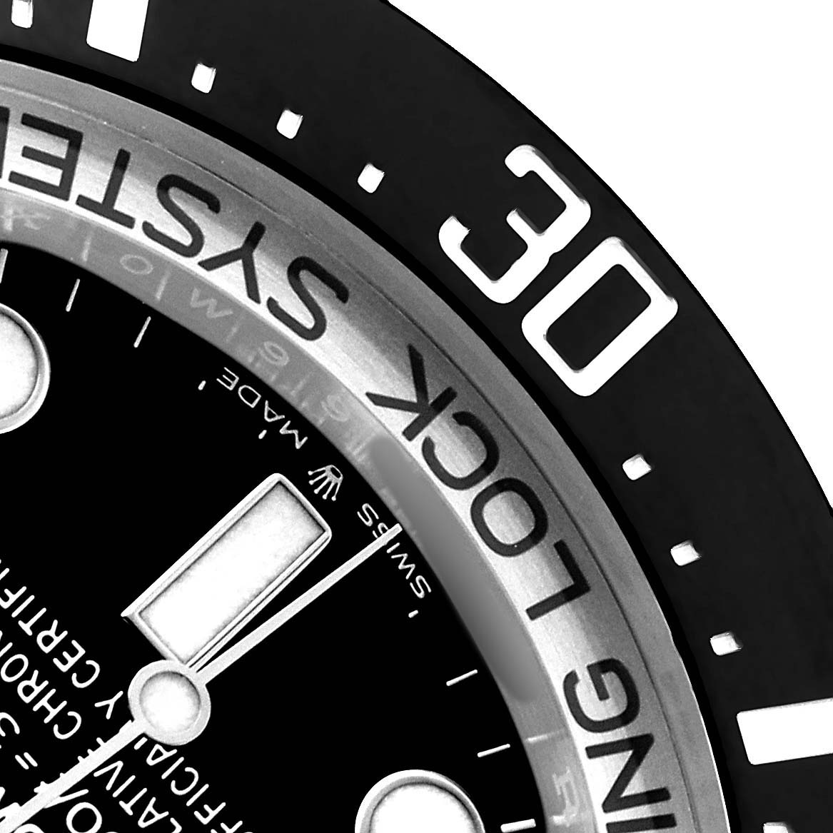 The image shows a close-up of the bezel and part of the dial of a Rolex Sea-Dweller 126660 Men's Stainless Steel Blue Dial watch from the side angle.