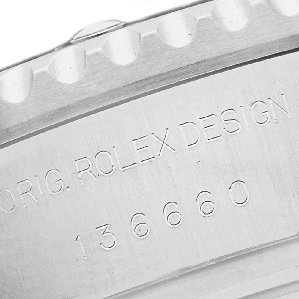 The image shows a close-up of the case side of a Rolex Sea-Dweller 136660 Men's Stainless Steel Black Dial, highlighting the engraved model number and design details.