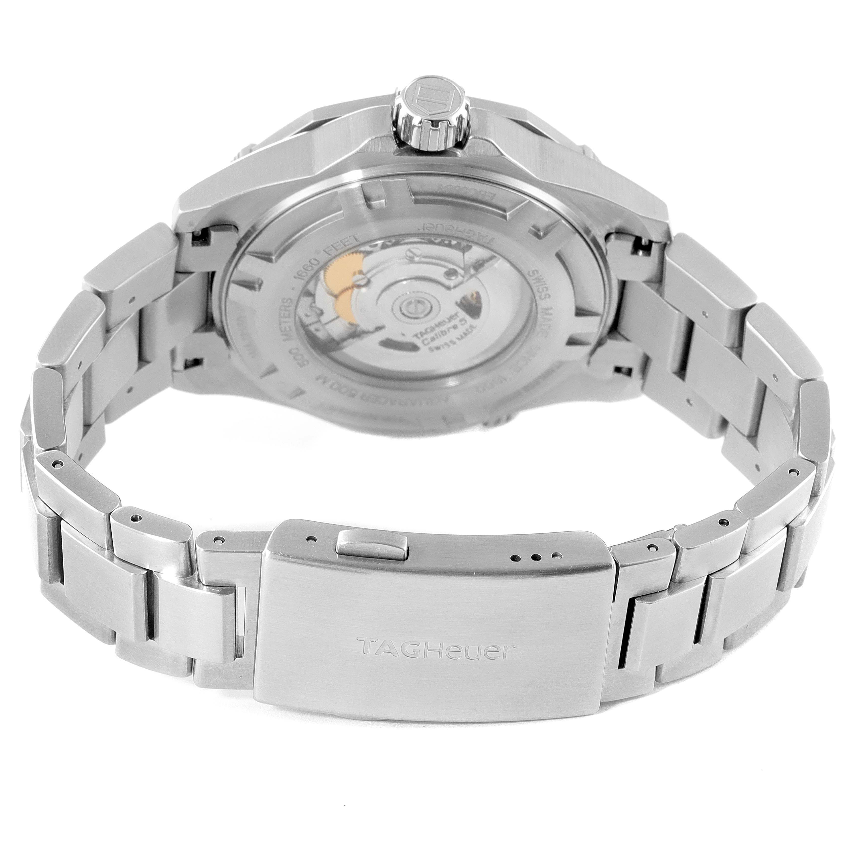 The image shows the back case and bracelet of a Tag Heuer Aquaracer WAJ2150.BA0870 Men's Steel and Gold (two tone) Black Dial WAJ2150.BA0870 Men's Steel and Gold (two tone) Black Dial watch, highlighting the clasp and watch movement.