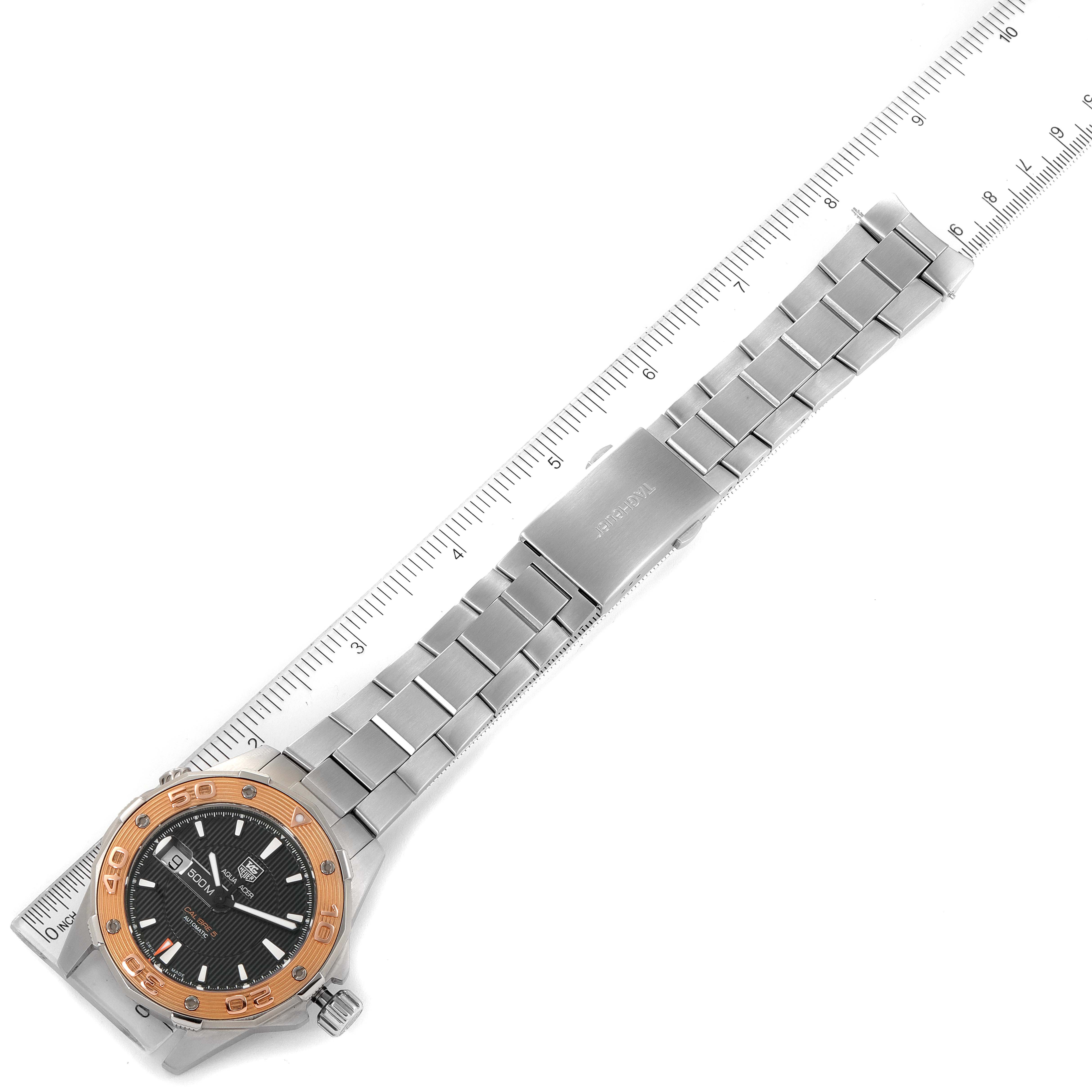 The image shows a Tag Heuer Aquaracer WAJ2150.BA0870 Men's Steel and Gold (two tone) Black Dial WAJ2150.BA0870 Men's Steel and Gold (two tone) Black Dial watch laid out flat, with a ruler beside it for measurement.
